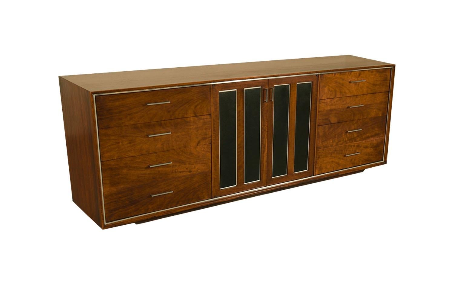 Extraordinary Mid-Century Modern 9 drawer dresser by Lane Furniture. This retro piece was constructed with top of the line hardware, and excellently crafted woodwork. Features six dovetailed drawers accented with chrome drawer pulls flanking center
