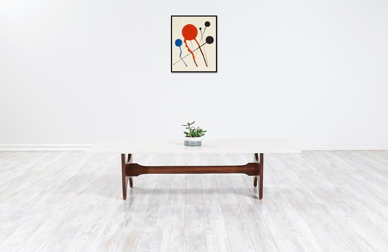 Midcentury walnut coffee table with marble top.