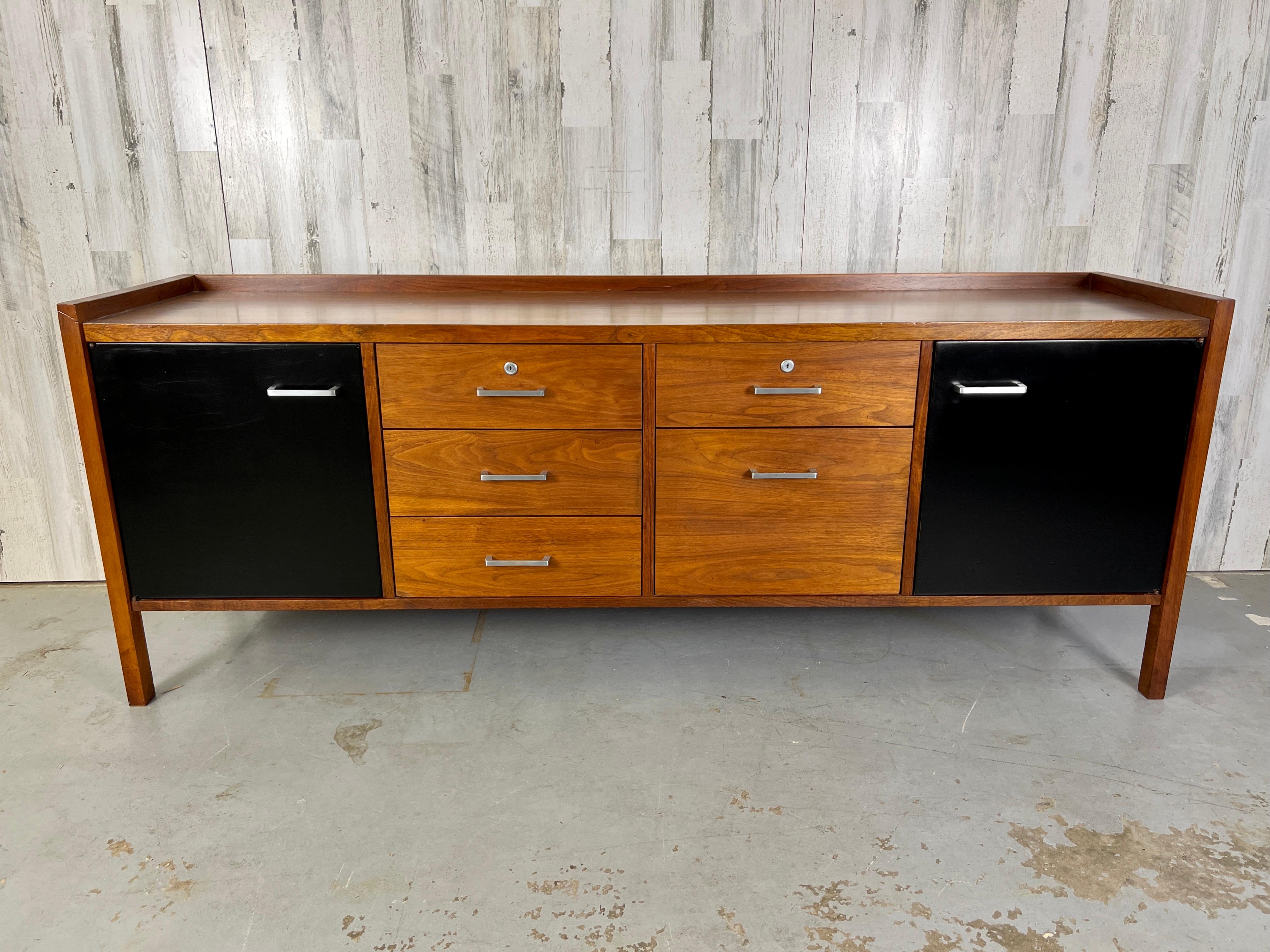 Mid century credenza walnut with black masonite doors with file drawer.