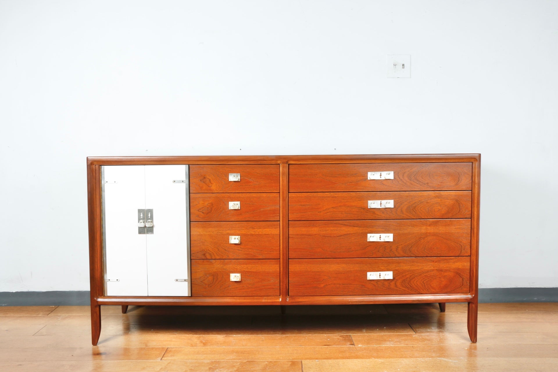 Vintage mid-century refinished credenza with painted white doors. Yea defect size with working drawers. Chrome accent. Hardware. Lots of storage space.