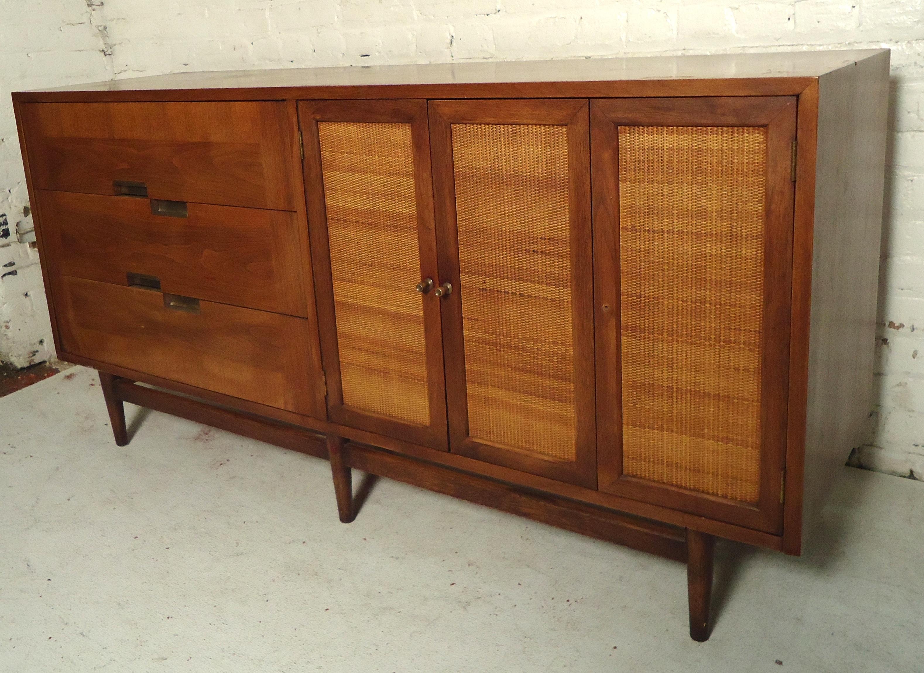 American of Martinsville credenza with six total drawers. Caned doors, metal pulls and inlay metal crosses on top. Merton Gershun for American of Martinsville.

(Please confirm item location - NY or NJ - with dealer).
 