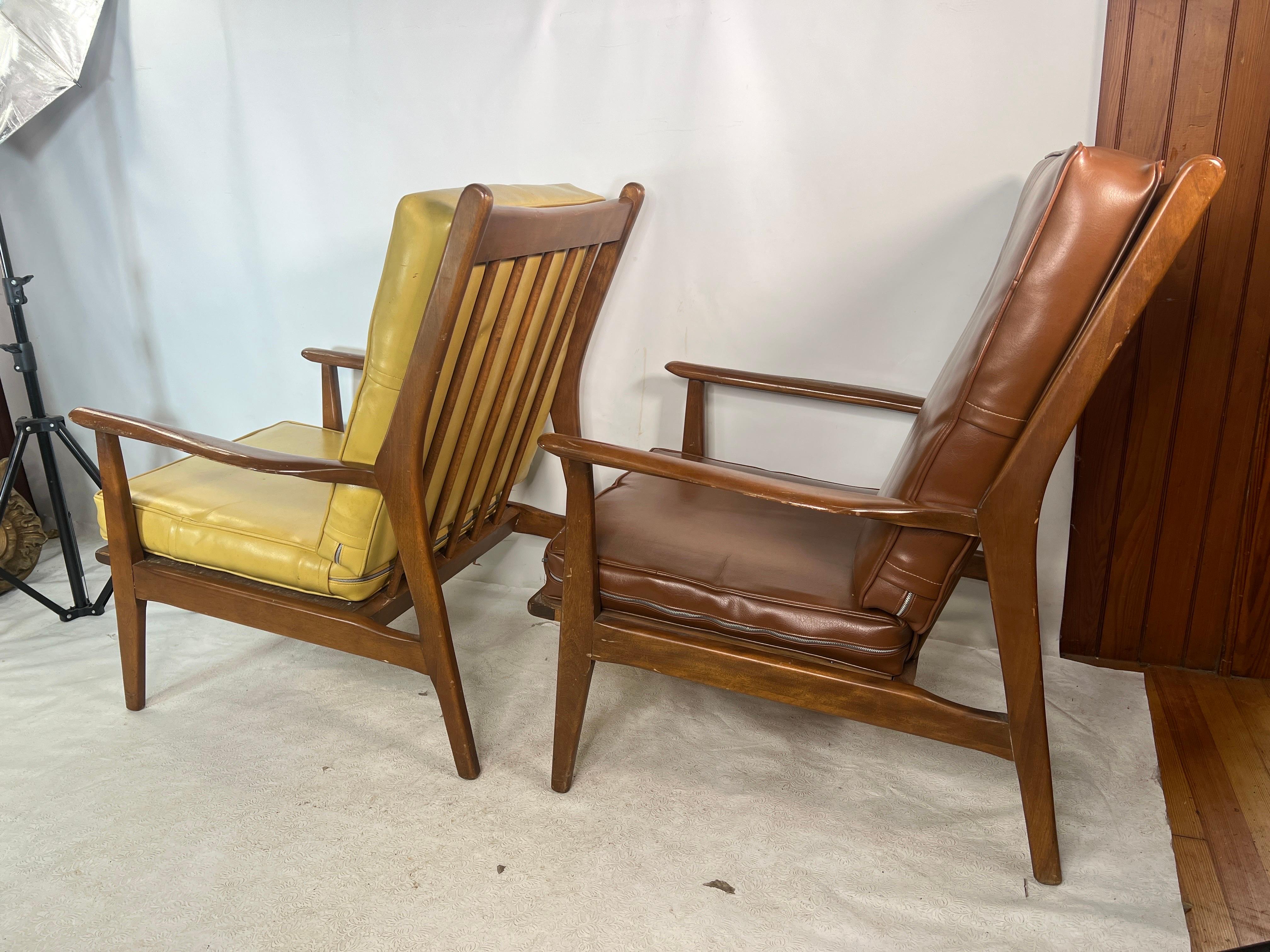 For sale is this great pair of vintage lounge chairs that are made out of walnut.
