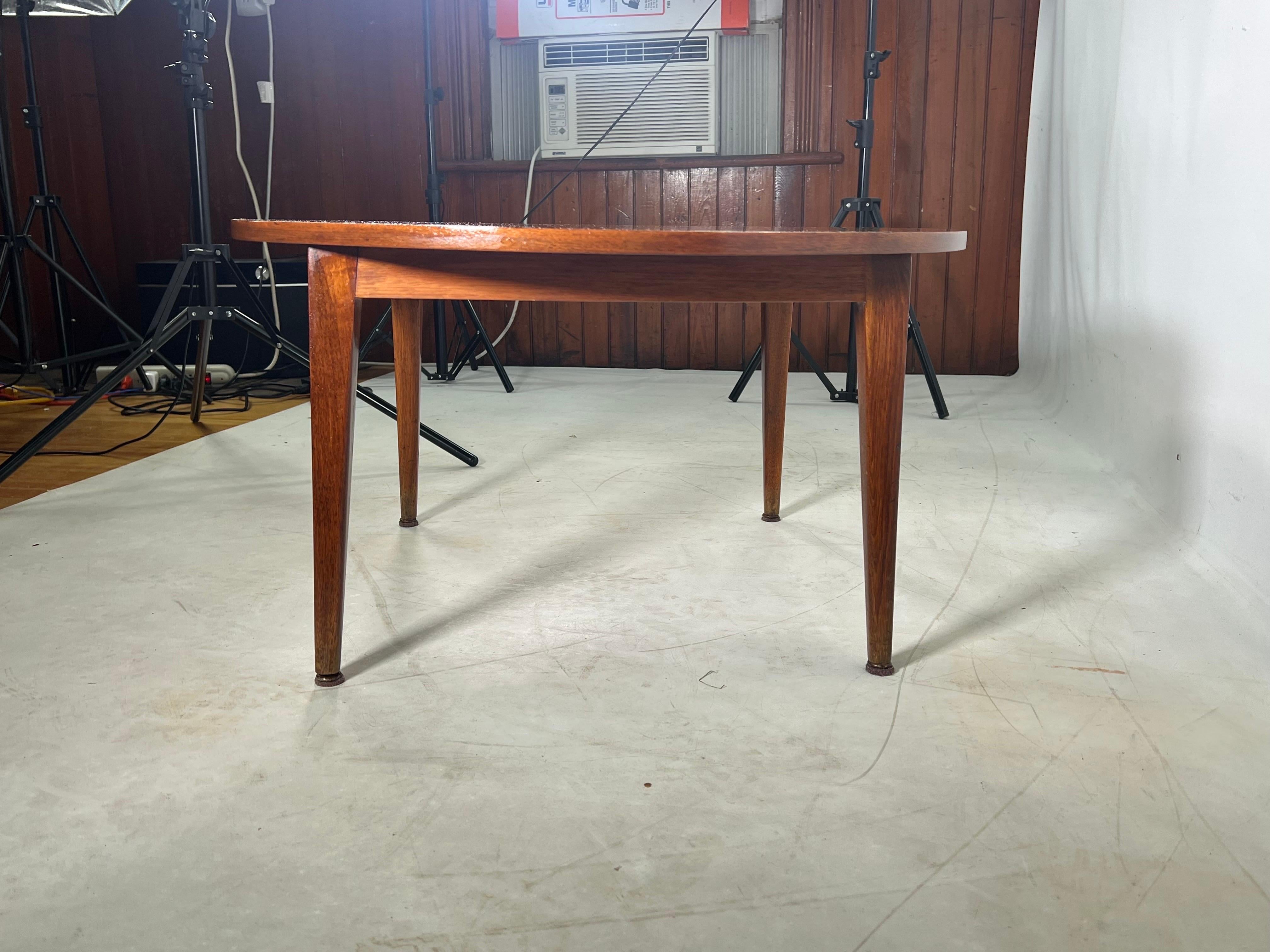 The coffee table has very nice wood grain and is made out of walnut. The table is light weight and looks to be in the Danish style. We currently have two tables available. Each table is 499.