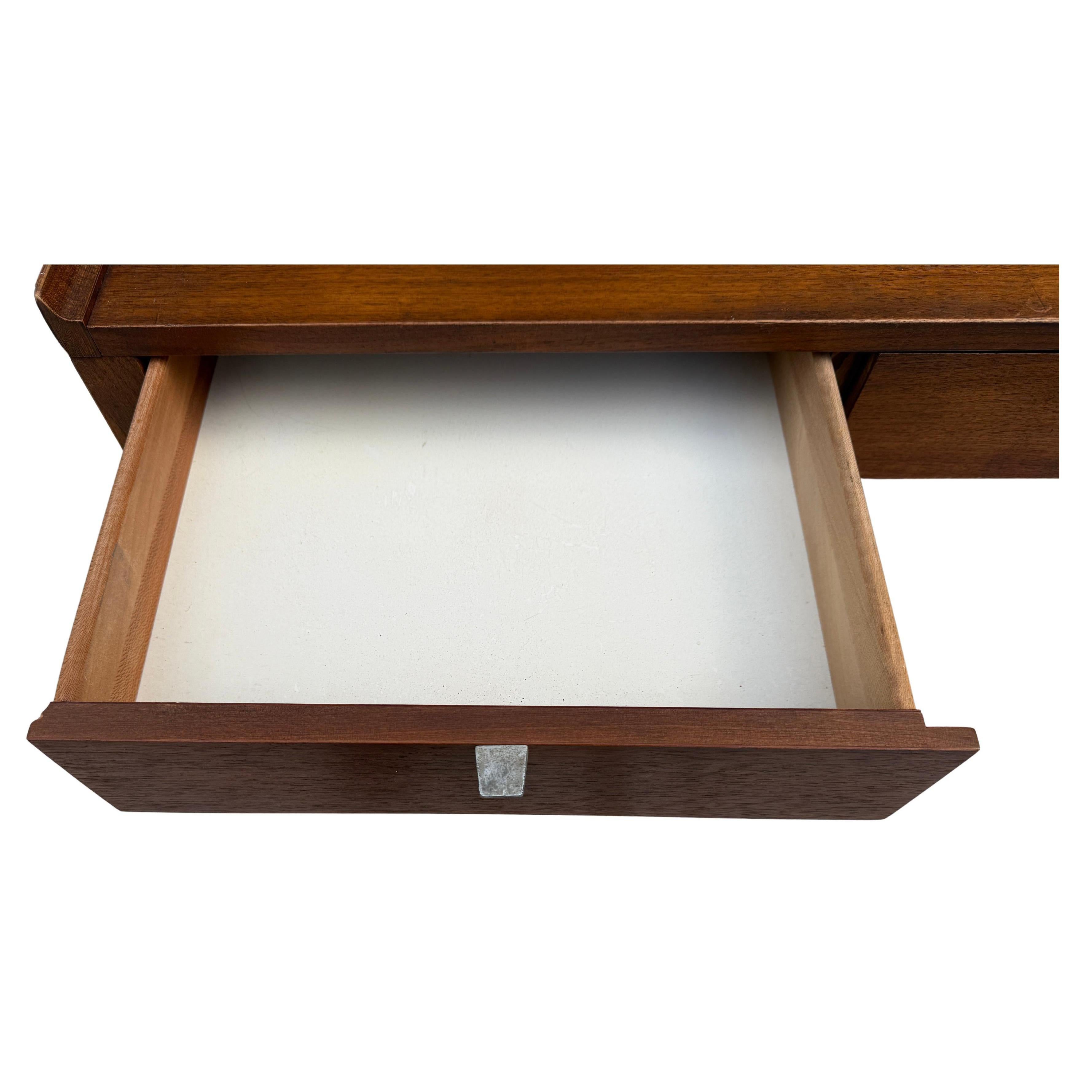 Mid Century walnut Desk by Arthur Umanoff for Cavalier 20th century. This (3) central drawers flanked by (3) side drawers and an upper shelf with sliding compartment. Made in USA located in Brooklyn nyc. 

Measures 52” x 24” x 37” high 
