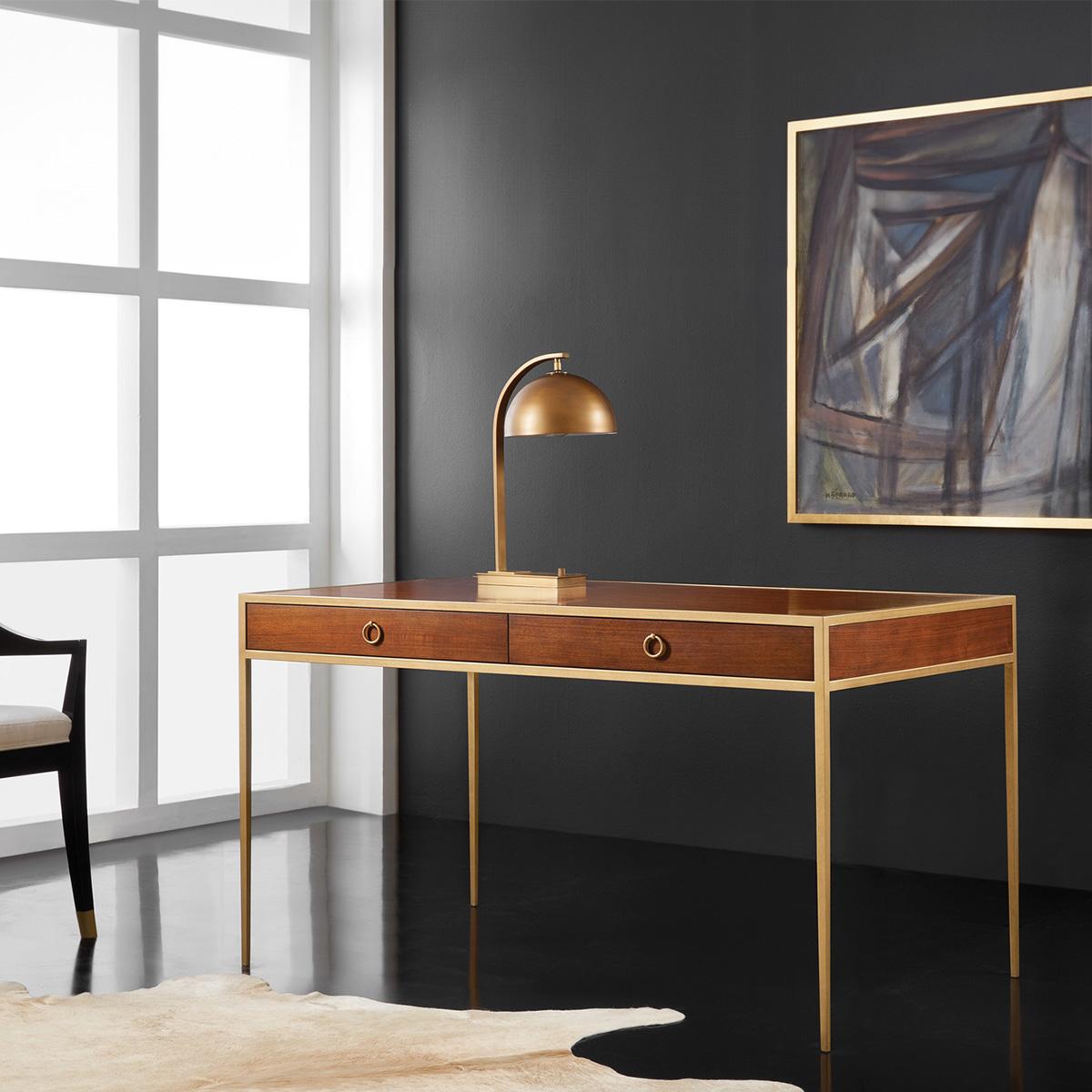 Midcentury Walnut Desk. Built with a solid oak frame and with a warm walnut veneer writing top and frieze with a simple elegant gilded iron frame. The writing table has two soft closing drawers with ring pull handles. 

Dimensions: 54