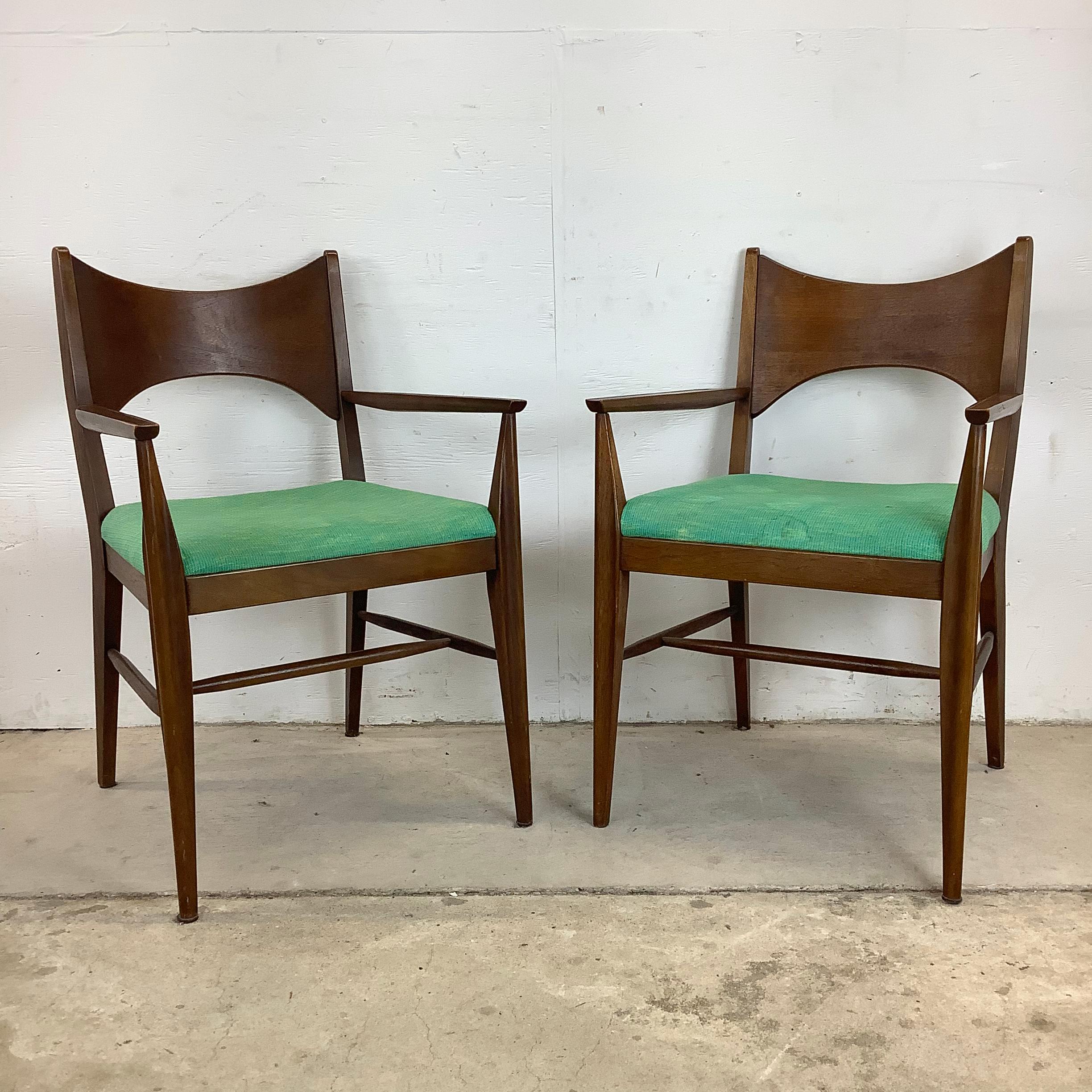 Introducing this striking set of mid-century Broyhill Saga Dining Chairs – a timeless blend of style, comfort, and quality. Crafted with exquisite attention to detail, these chairs boast the iconic design and quality craftsmanship synonymous with