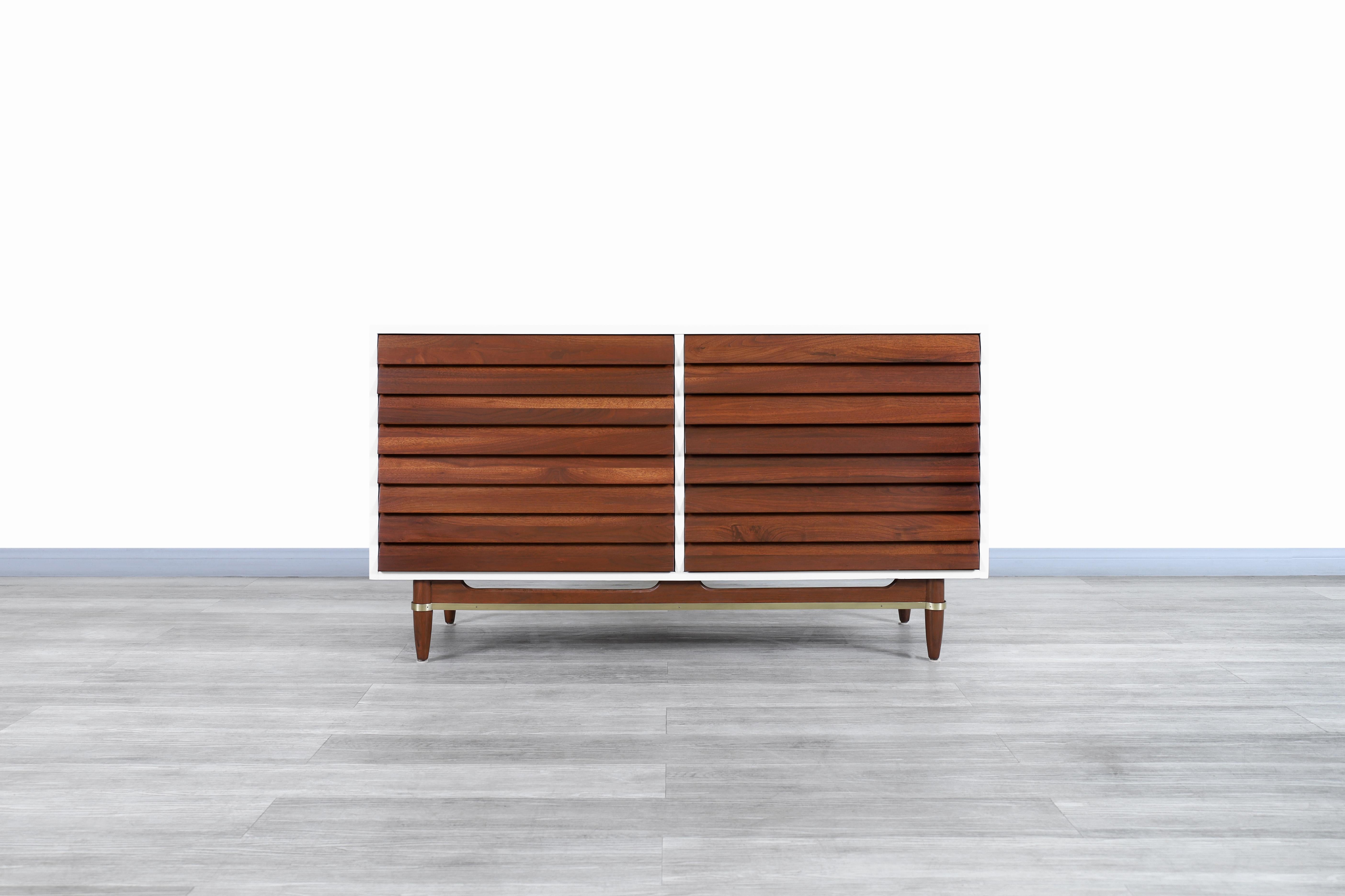 Fabulous mid century walnut and lacquered dresser designed by Michael L. Gershun for American of Martinsville in the United States, circa 1960s. This credenza has been constructed from the highest quality walnut wood. Features a white lacquered box