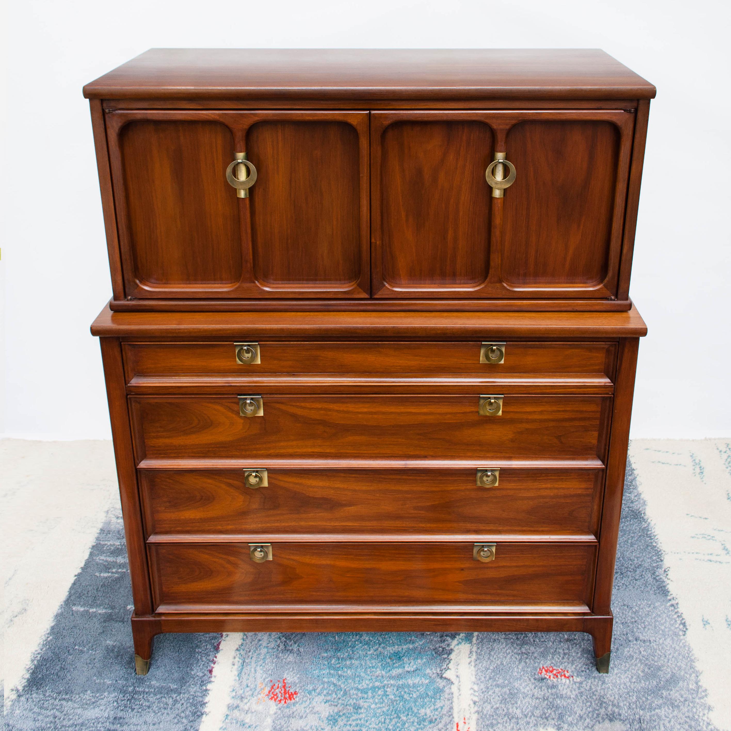Sophisticated midcentury walnut dresser with beautiful wood grain by White Fine Furniture Company of Mebane, North Carolina. Exceptionally made, this dresser features stylish solid brass pulls and tapered legs with brass capped feet.
This solid