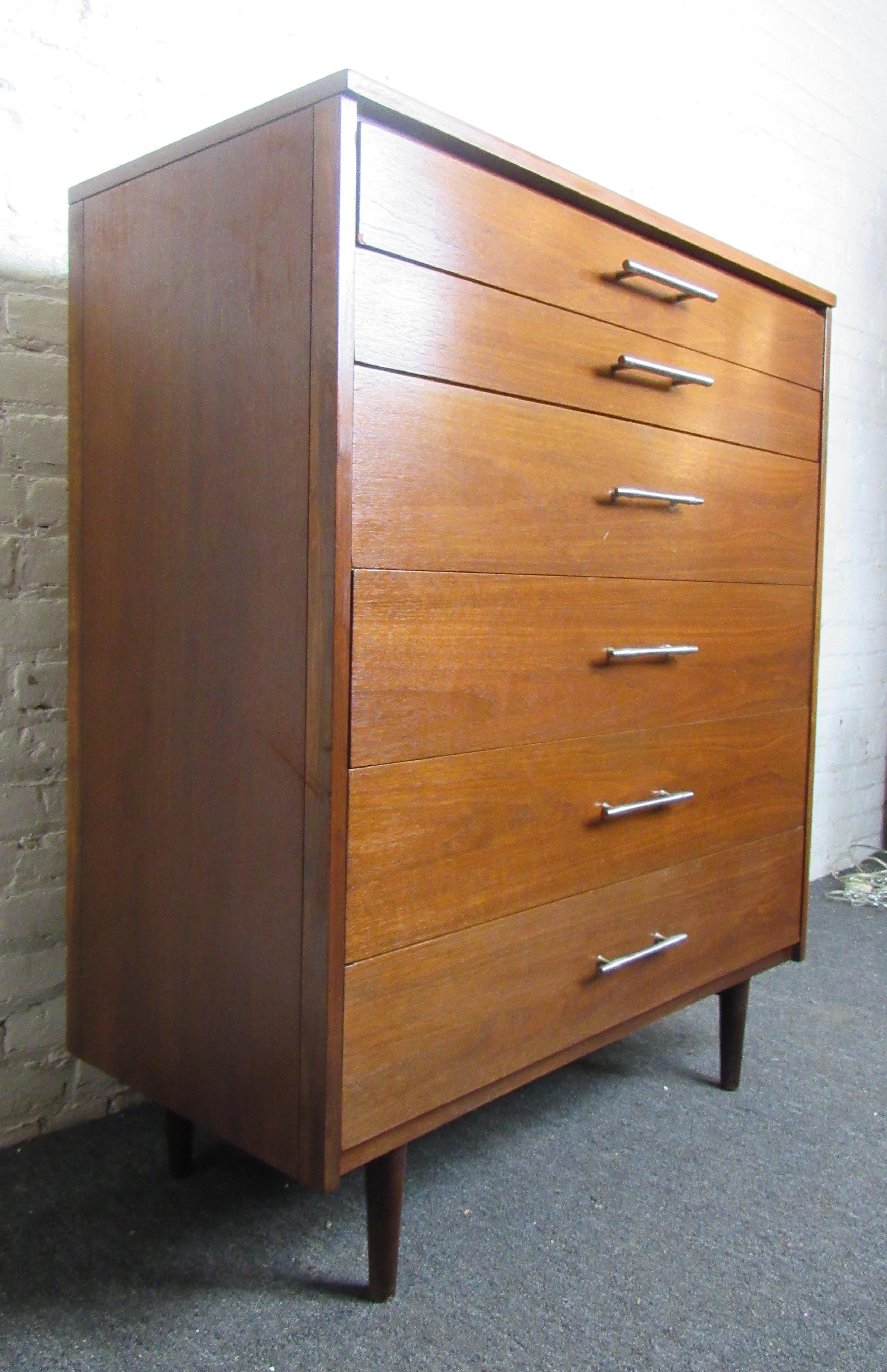 Tall high boy dresser with chrome handles. Walnut grain and tapered legs.

(Please confirm item location - NY or NJ - with dealer).
 