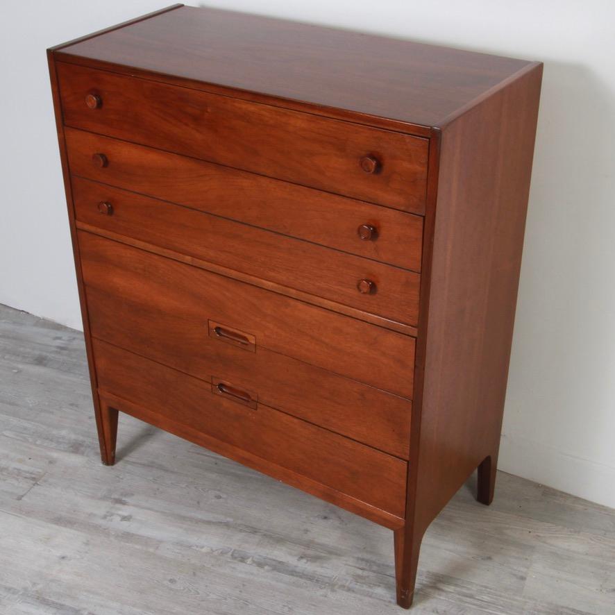 70s vintage dresser set from one of the premier Mid-Century Modern furniture maker of the time, United Furniture. The low walnut stained dresser has nine generous drawers while the highboy has five. Solid dovetailed construction mean this cool set