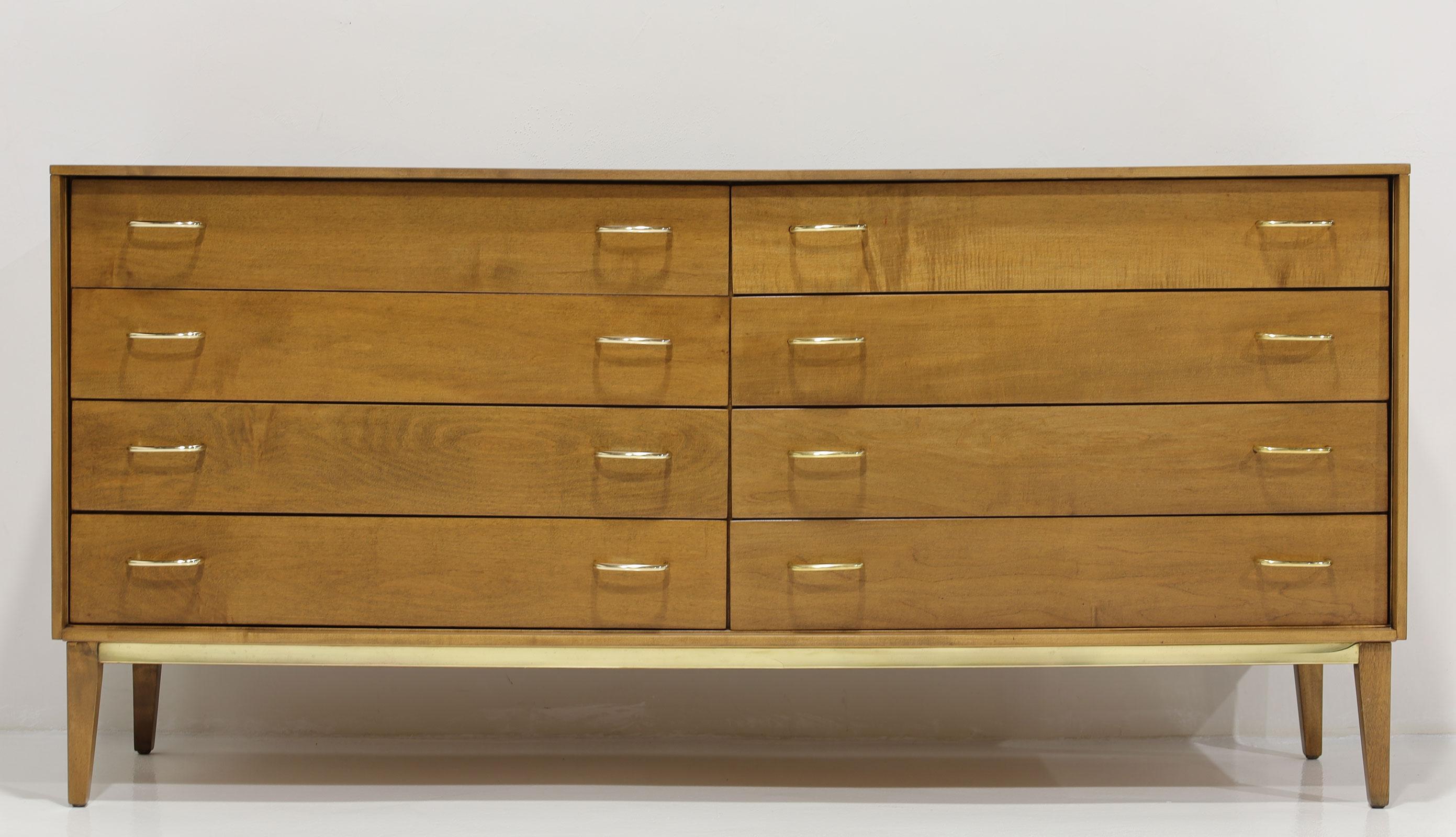 This is a lovely clean lined mid-century dresser made very well. The handles and trim are solid brass and we have polished them to bring back their old glory. A beautiful piece for an entrance, bedroom or hallway. They don't make them like this