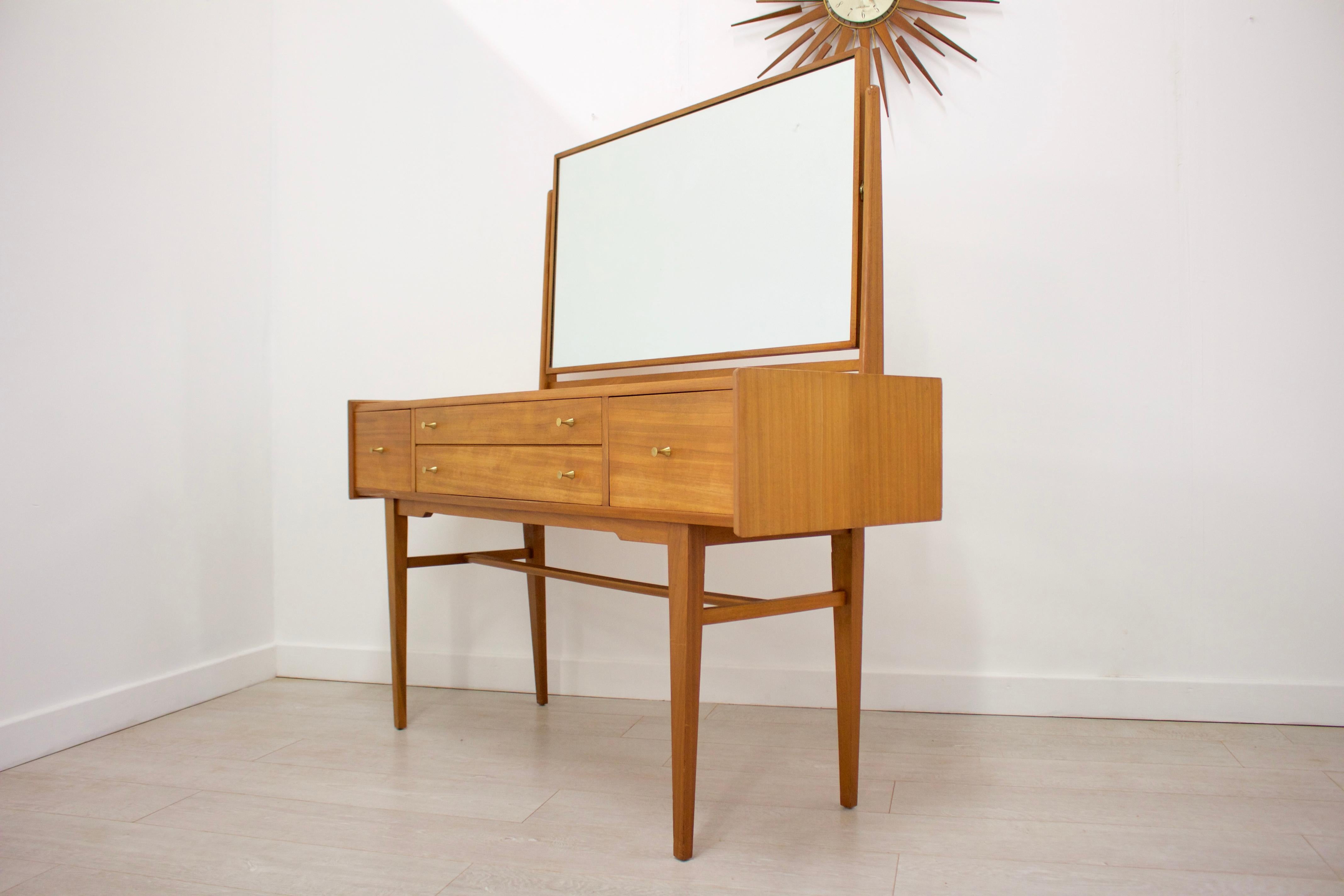 - Midcentury dressing table
- Made in the UK by Younger
- Made from Walnut & Walnut Veneer
- Height including the mirror: 130cm