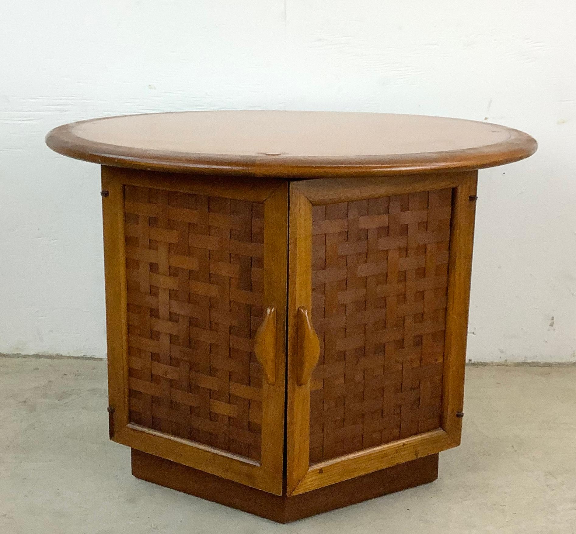 Immerse yourself in the charm of mid-century modern design with this Vintage Lane Perception Side Table. This exquisite piece, with its unique basketweave door fronts and hexagon cubby storage, is a marvel of design and functionality.

The side