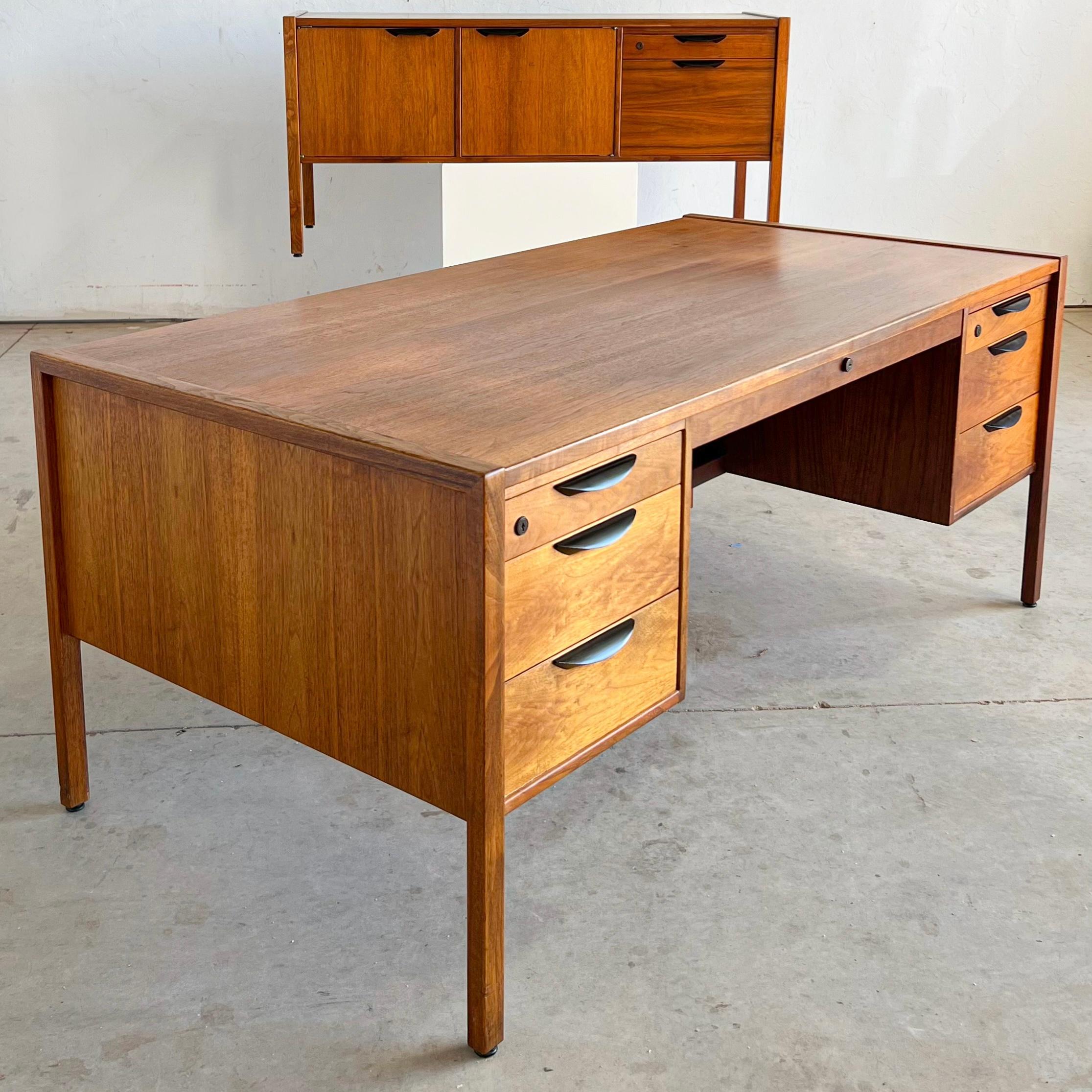 Mid century walnut executive Credenza by Jens Risom 

His credenza was bought new by a local law firm and never left it’s spot until we found it! both pieces feature the same black iron demilune pulls, with all drawers on ball-bearing and fully