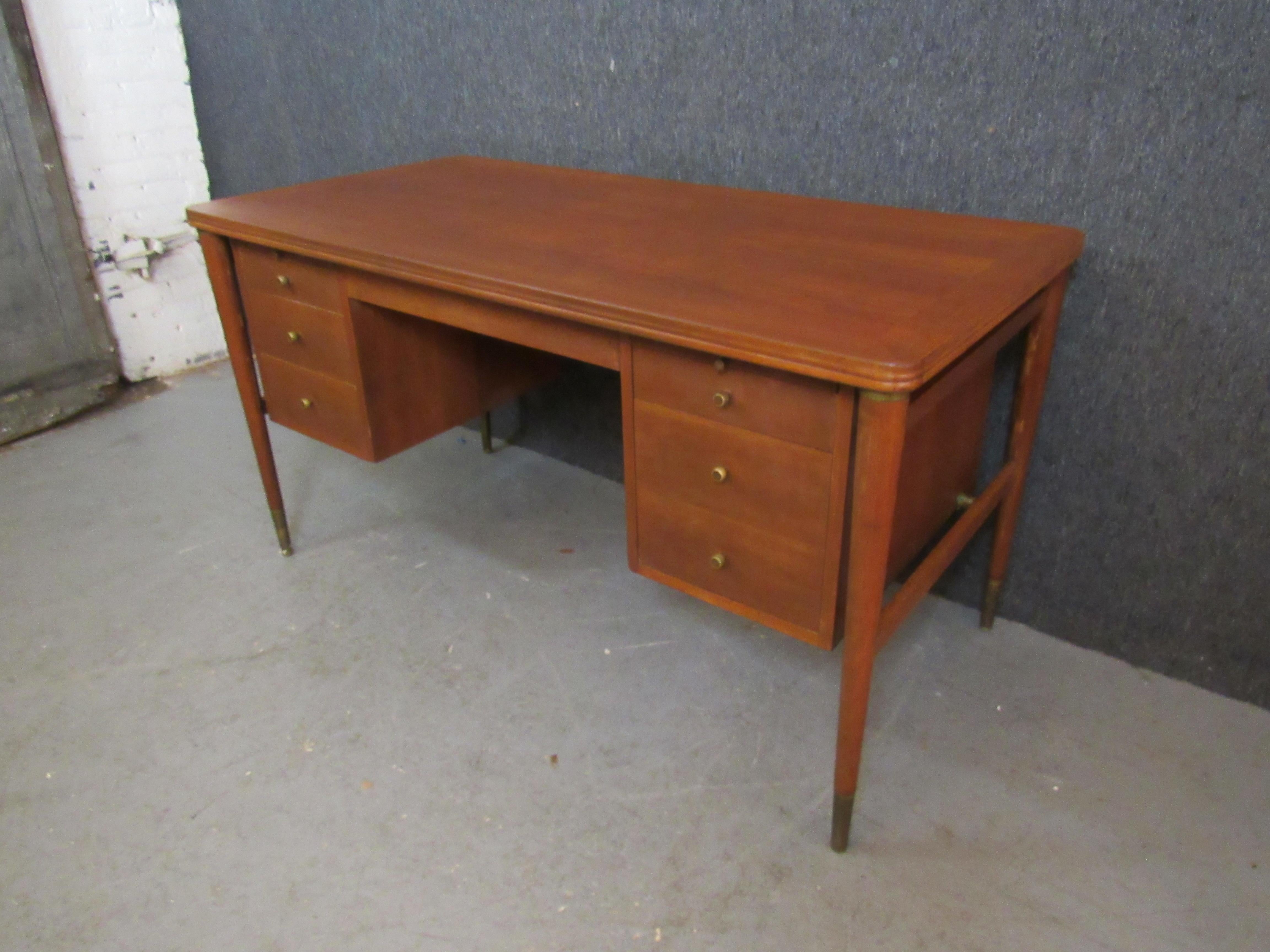 Elegant mid-century vintage desk from skilled craftsmen of Grand Rapids' John Widdicomb Fine Furniture. An ample walnut desktop measuring over 10 square feet offers plenty of workspace for even the biggest projects, while tapered, solid legs give