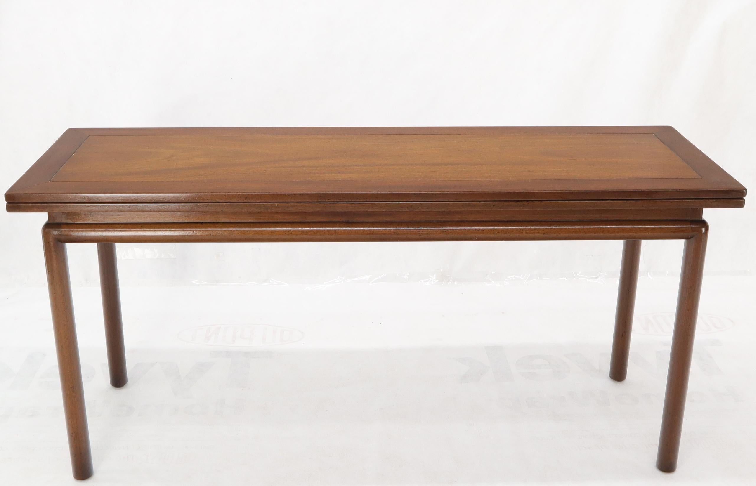 Mid-Century Modern flip top long console dining table with storage compartment.