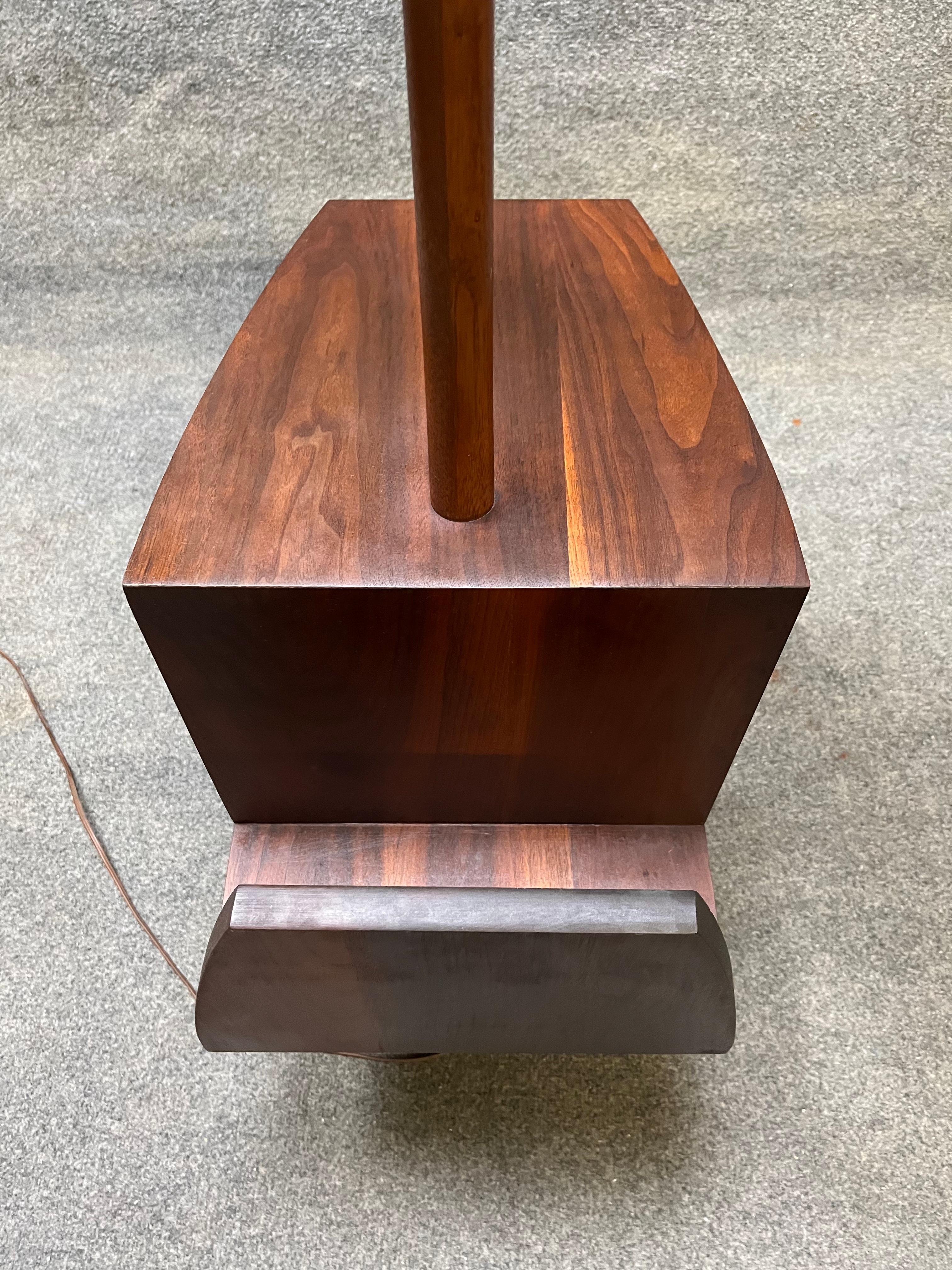 Here is an amazing vintage mid century solid black walnut floor lamp with built in table and magazine rack. This piece is so cool! Would look great next to a lounge chair or sofa. Lamp has a brand new off white linen lamp shade. Lamp is in good
