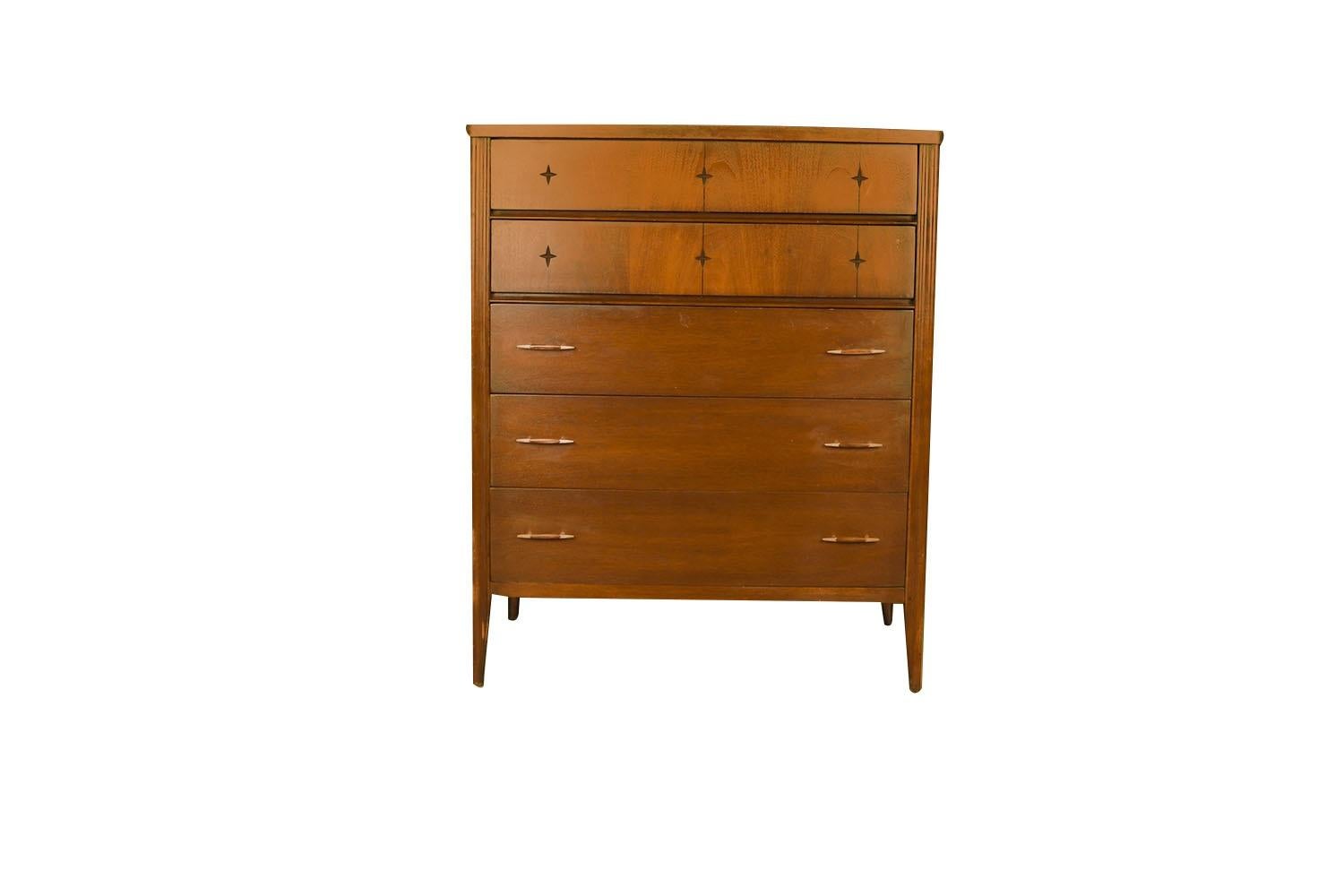 A beautiful, sleek mid-century modern walnut, Highboy Dresser circa early 1960’s from Broyhill Premier’s “Saga” collection. This absolute jewel remains in nearly pristine condition. The lines are clean and elegant. Features five spacious drawers