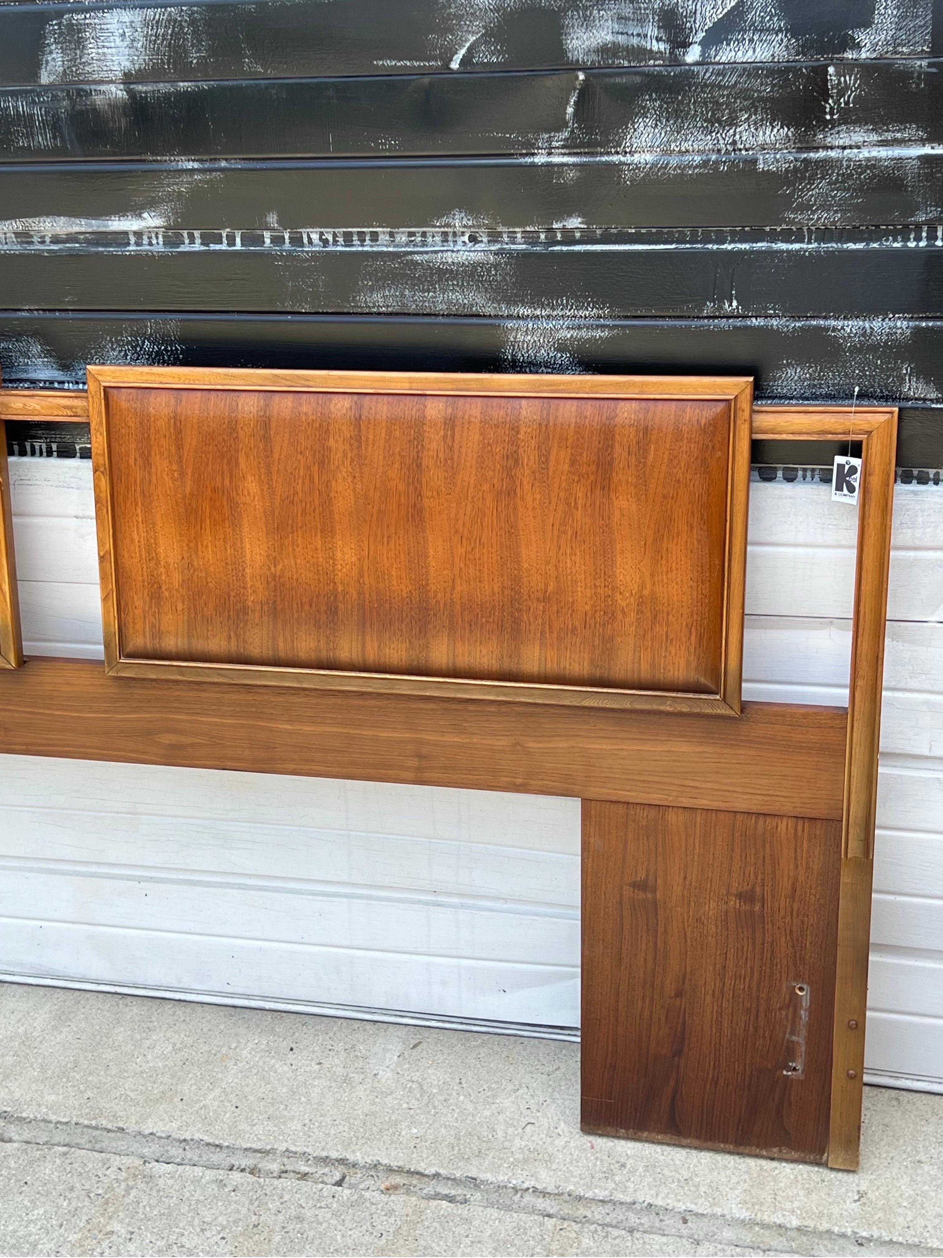 Mid-century king headboard designed by Lane Furniture, circa 1960s. This is a wonderful opportunity to purchase an American made king size headboard from the mid-century, as they are seldom seen. Made from warm walnut wood and featuring two large