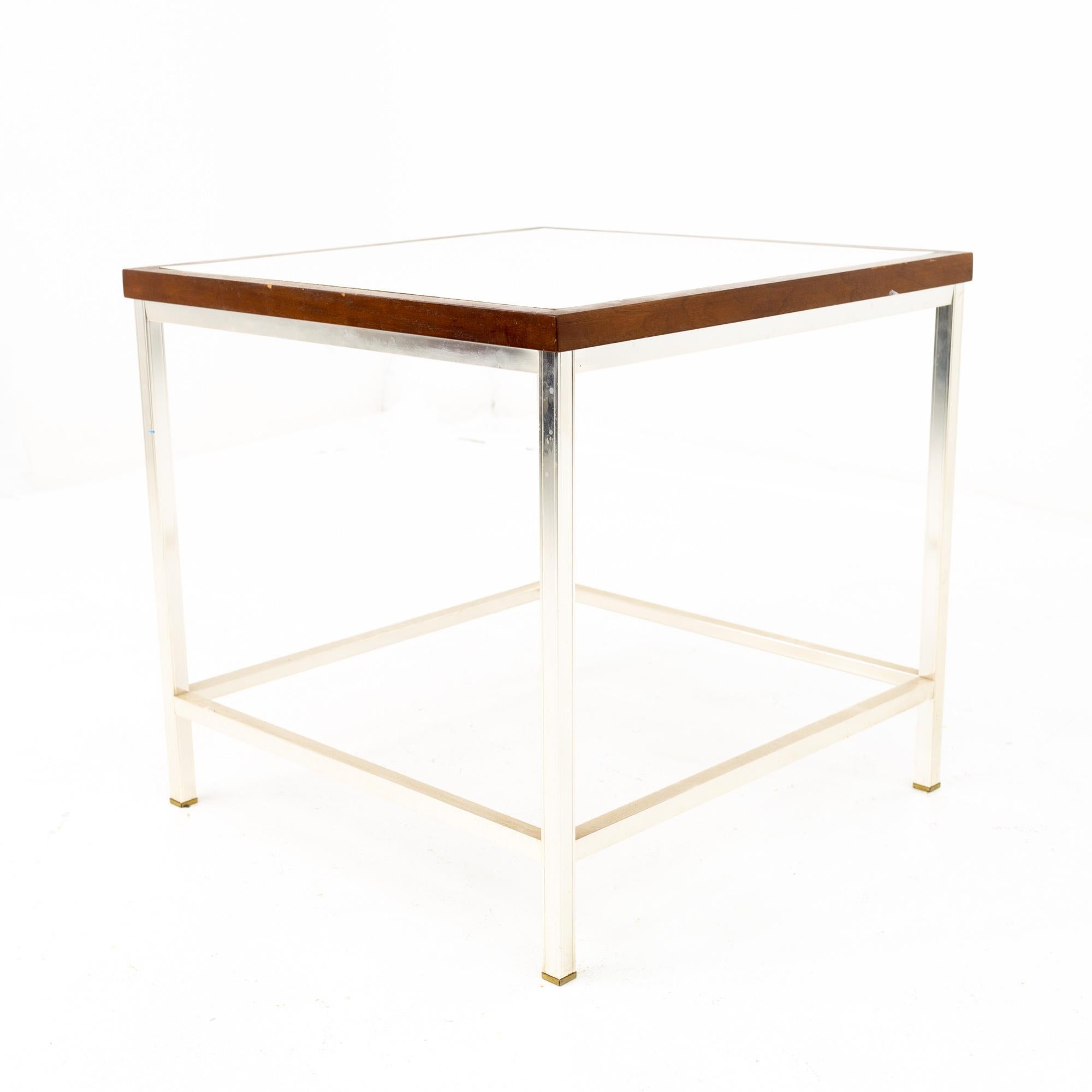 Mid century walnut laminate and chrome side end table
This end table is 22 wide x 22 deep x 21 inches high

All pieces of furniture can be had in what we call restored vintage condition. That means the piece is restored upon purchase so it’s free