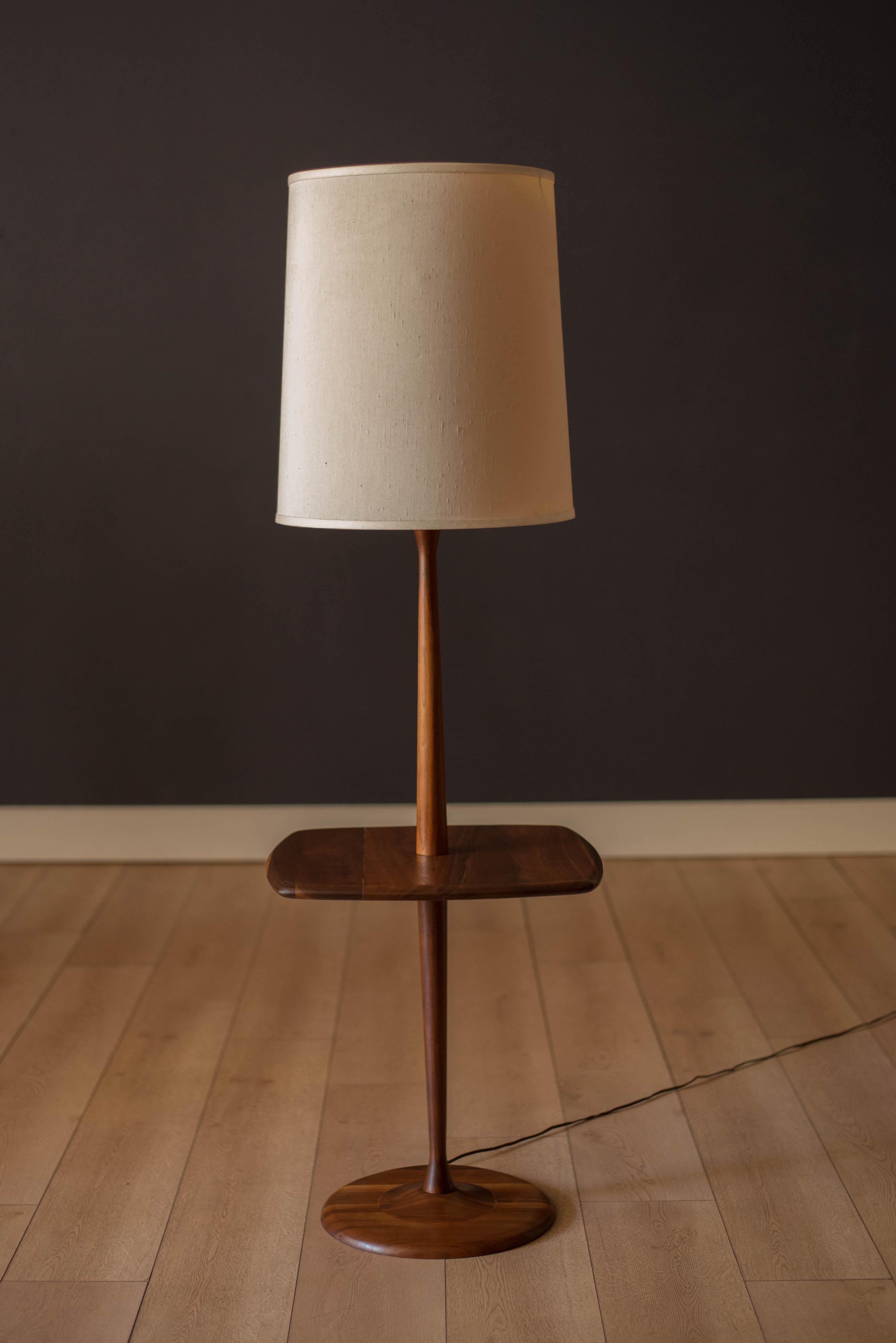 Vintage floor lamp with side table by Laurel Lamp Co., circa 1960s. This piece is made of solid planked walnut equipped with a three-way light switch. Drum shade and harp not included. 

End table height: 20.5