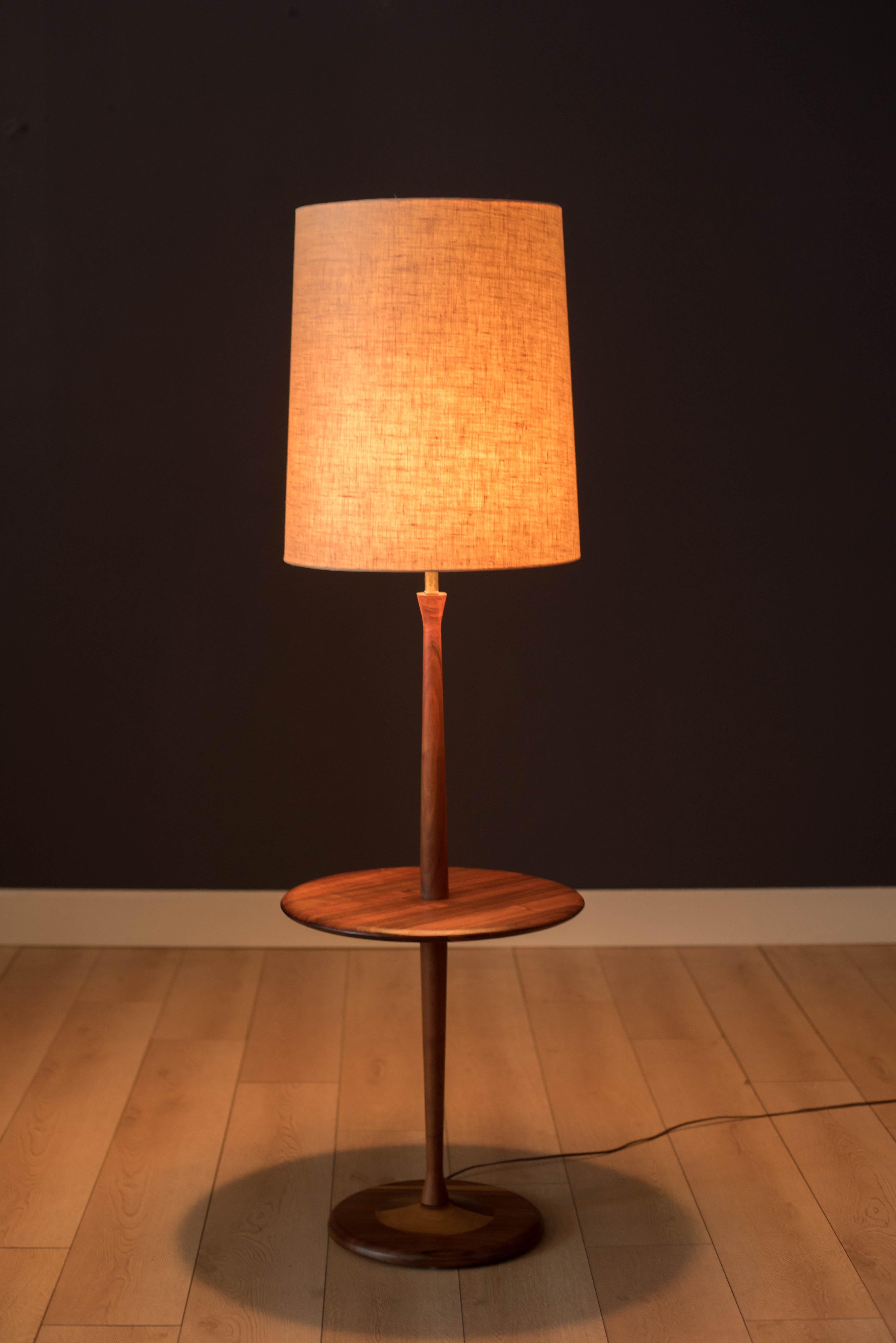 Vintage floor lamp with round side table by Laurel Lamp Co., circa 1960s. This piece is made of solid walnut and functions with a three-way switch. Drum shade is not included. 

 End table height: 20.5