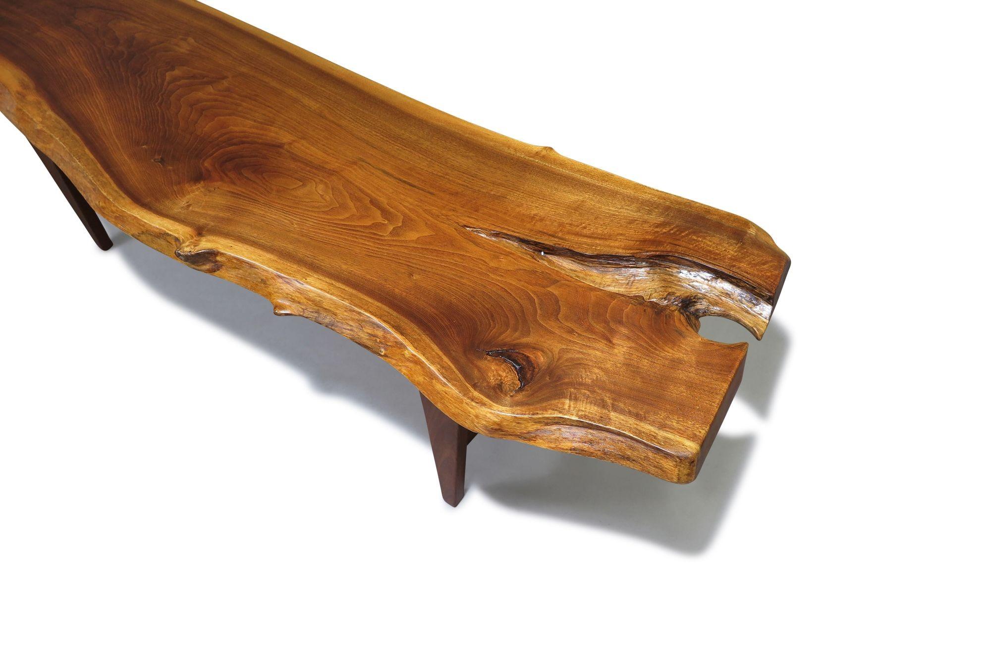 Mid Century live edge bench or coffee table is crafted of a solid walnut slab raised tapered wood legs.Can be used as a bench or a coffee table. Restored in a natural oil finish. Excellent condition.
Measurements
W 68'' x D 19'' x H 18.75''