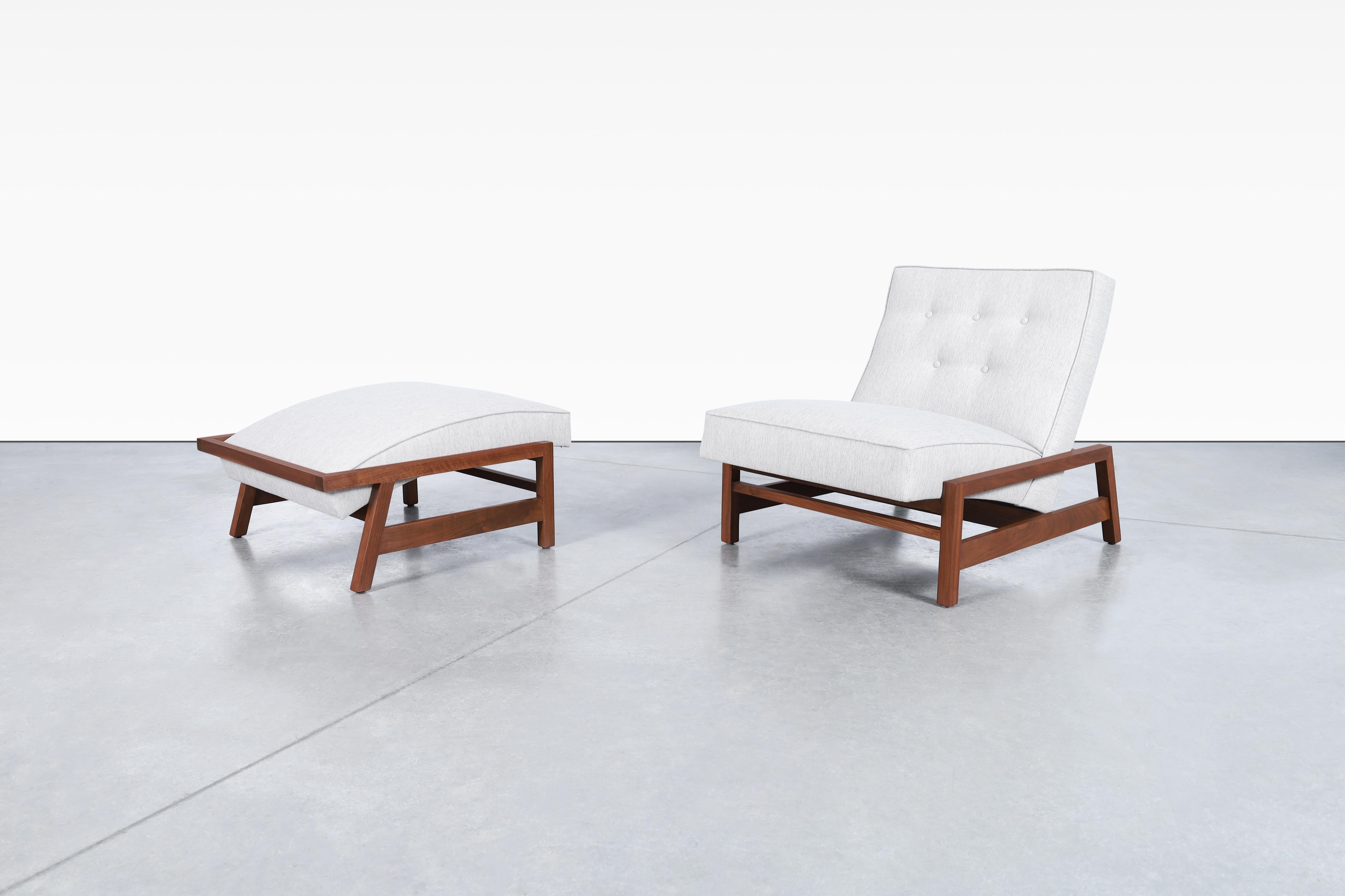 Stunning mid-century walnut lounge chair and ottoman styled after Tobia Scarpa in the United States, circa 1960s. With the essence of Scarpa's design philosophy, this chair and ottoman have been refinished and reupholstered to breathe new life into