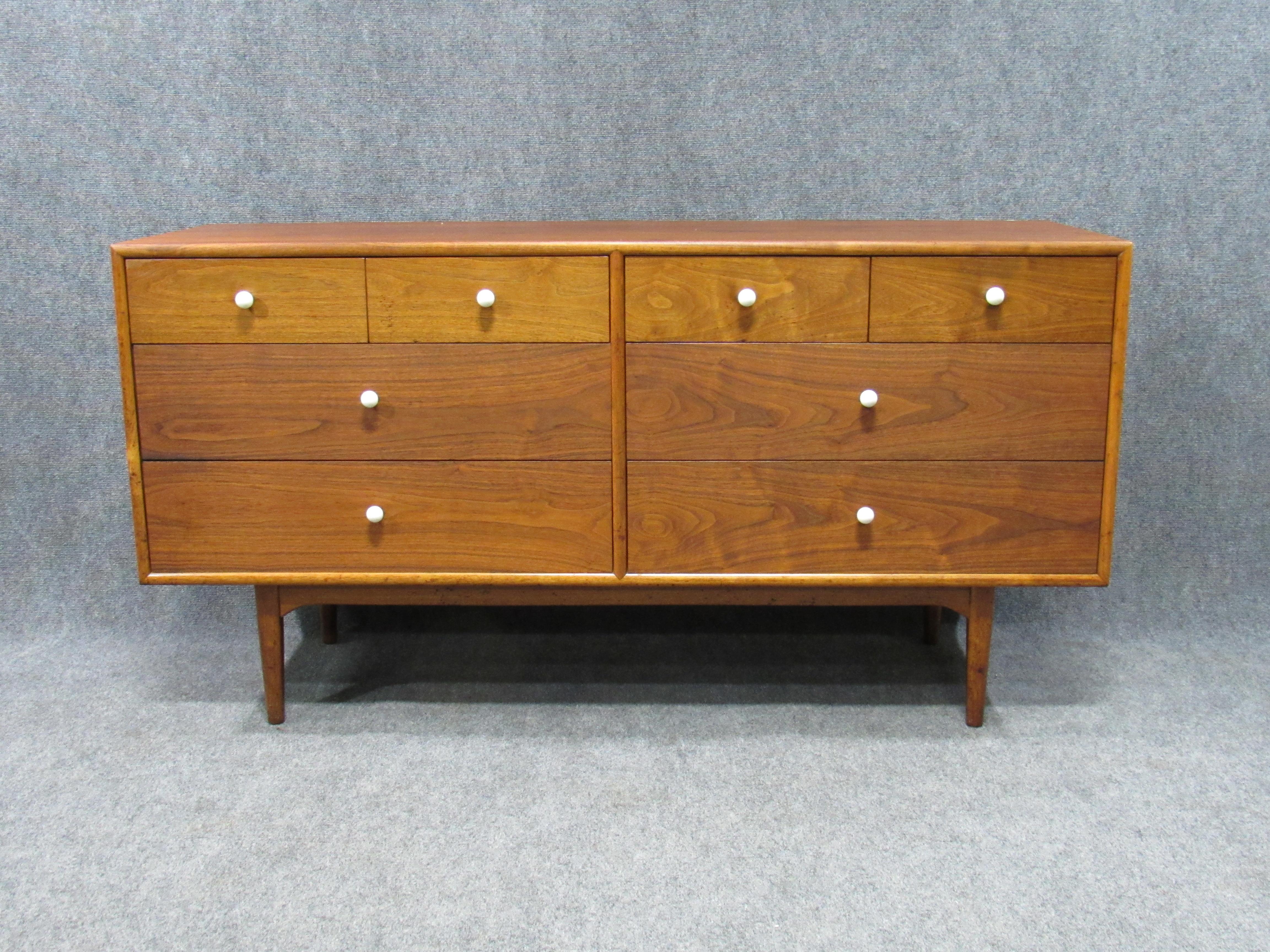 Midcentury walnut low and long chest of drawers by Kipp Stewart for Drexel. Excellent professionally restored vintage condition.
