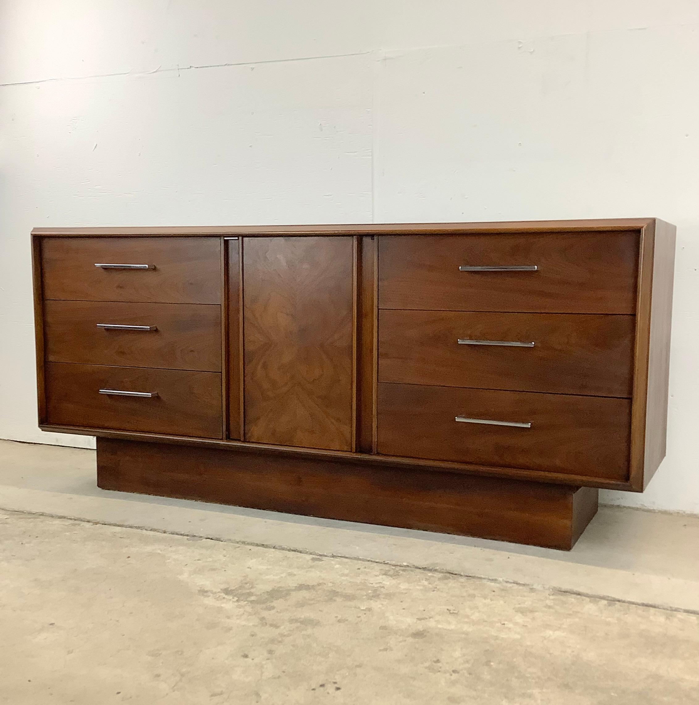 Are you in search of a storage piece that perfectly combines classic design, ample space, and a touch of mid-century charm? Look no further than this Mid-Century Modern Lane Dresser with pedestal base. This vintage gem offers both style and storage