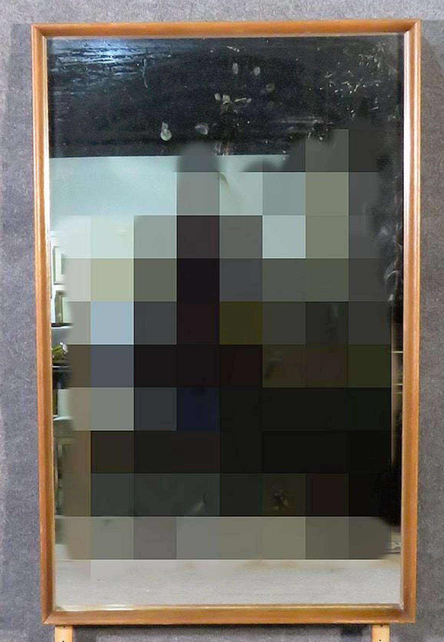 Vintage wall mirror with walnut wood frame.
(Please confirm item location - NY or NJ - with dealer).
  