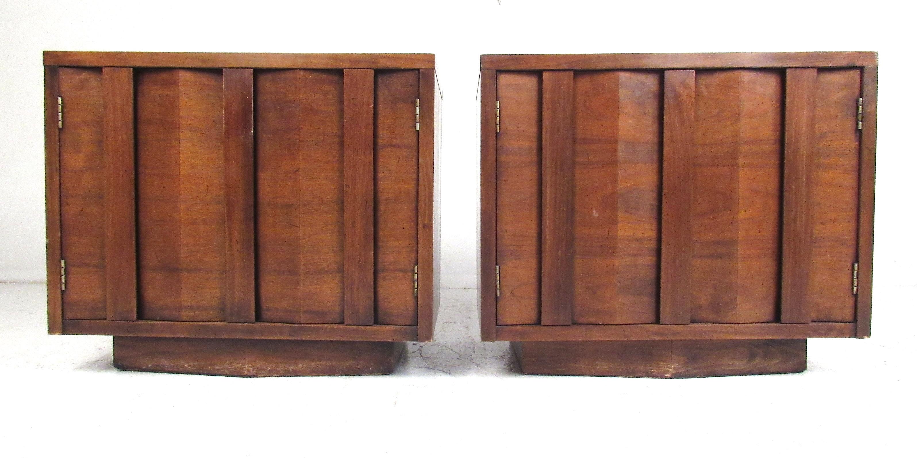 Vintage pair of double door midcentury walnut nightstands with single fixed shelf. 
Please confirm item location (NY or NJ) with dealer.