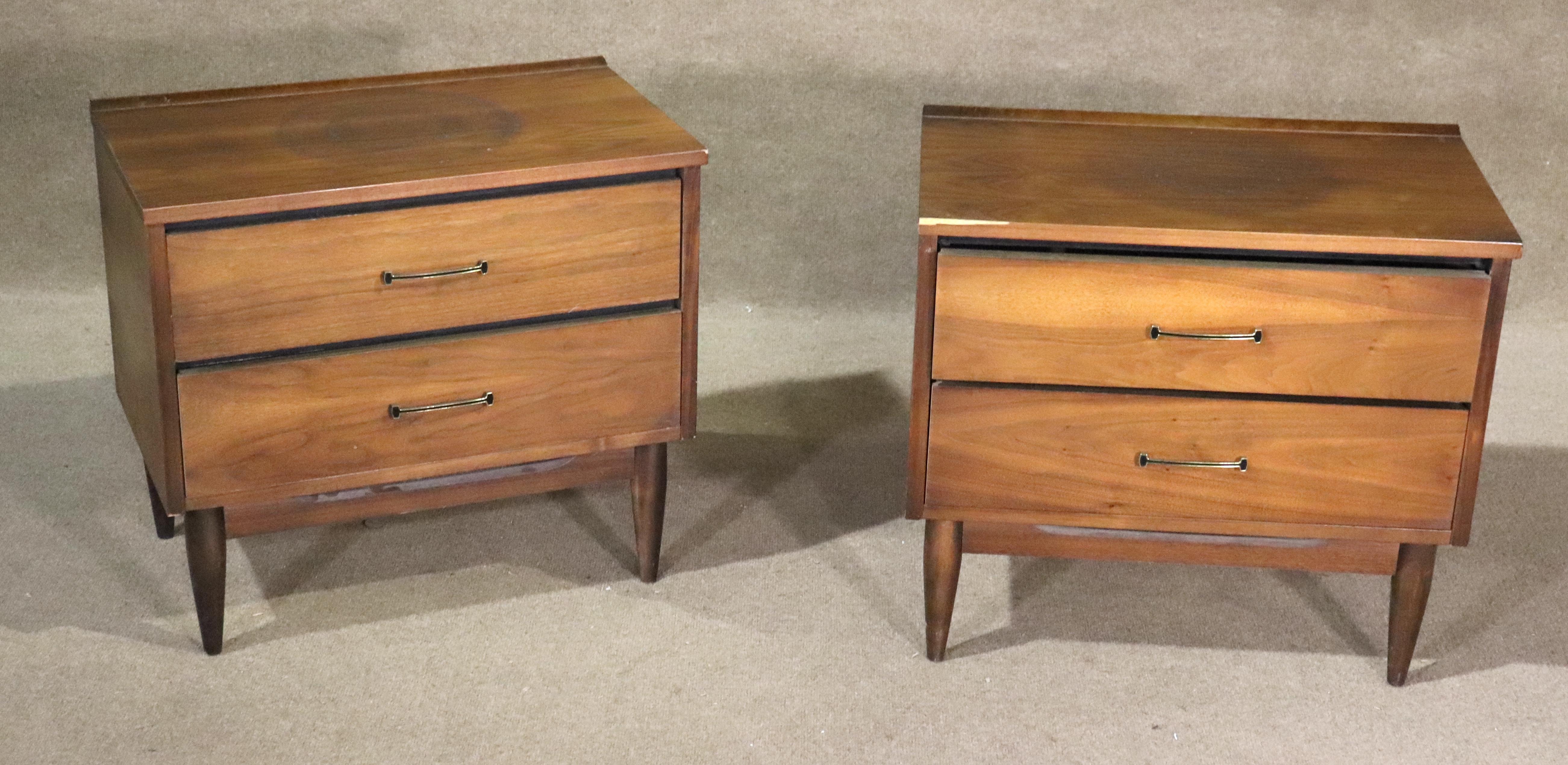 Pair of vintage American made end tables with two drawer storage. Simple mid-century design with metal handles and tapered legs. Great for bedside or living room use.
Please confirm location NY or NJ