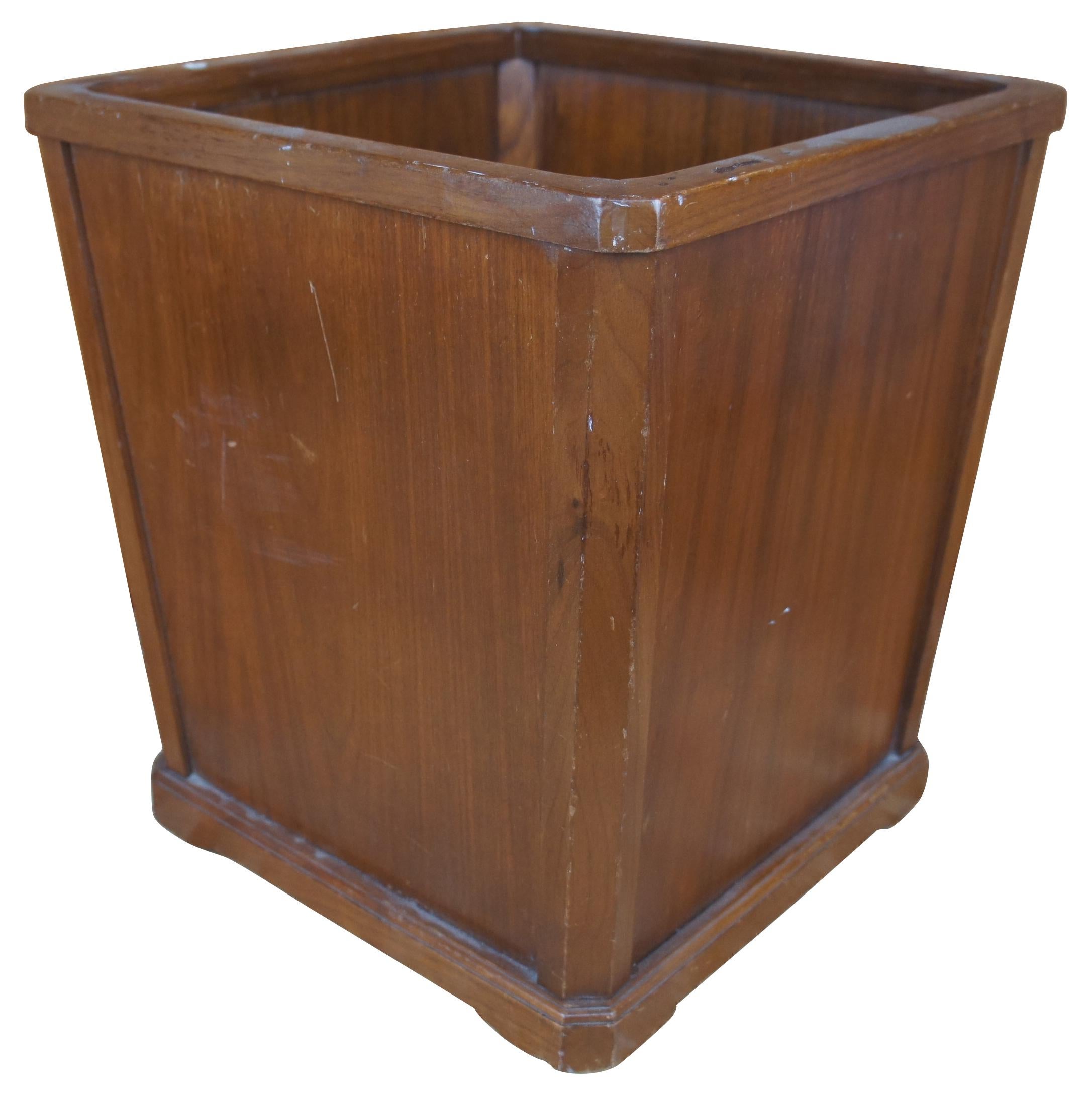 Large Mid-Century Modern executive desk walnut waste basket or wood trash can with square tapered form, attributed to Nucraft. Founded in Grand Rapids, Michigan, in 1945 by George W. Schad, Nucraft’s early days were built upon an idea to craft solid