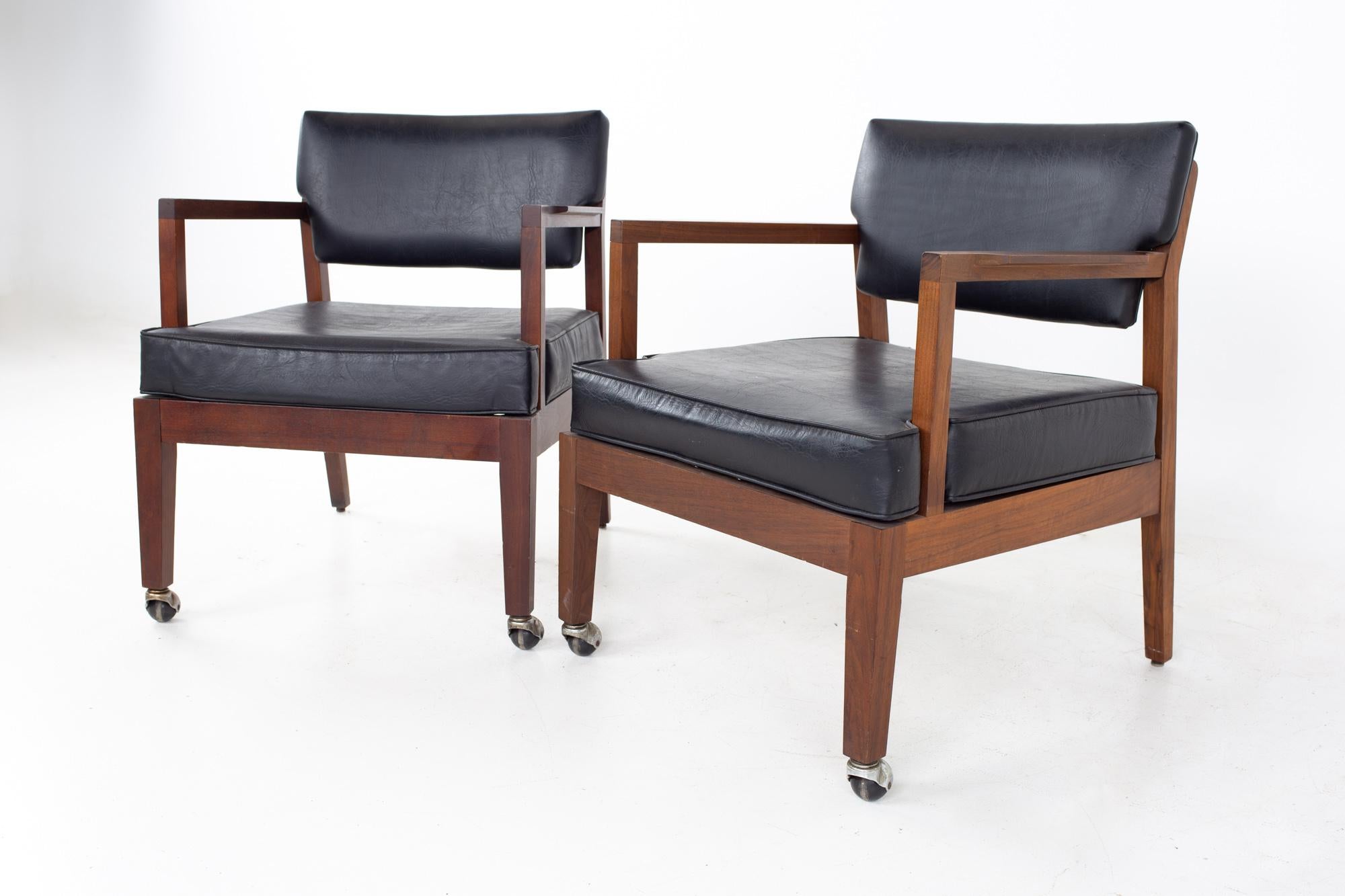 Mid century walnut occasional lounge chairs - A pair
Each chair measures: 24.25 wide x 25 deep x 29 high, with a seat height of 17 inches and arm height of 24.5

All pieces of furniture can be had in what we call restored vintage condition. That