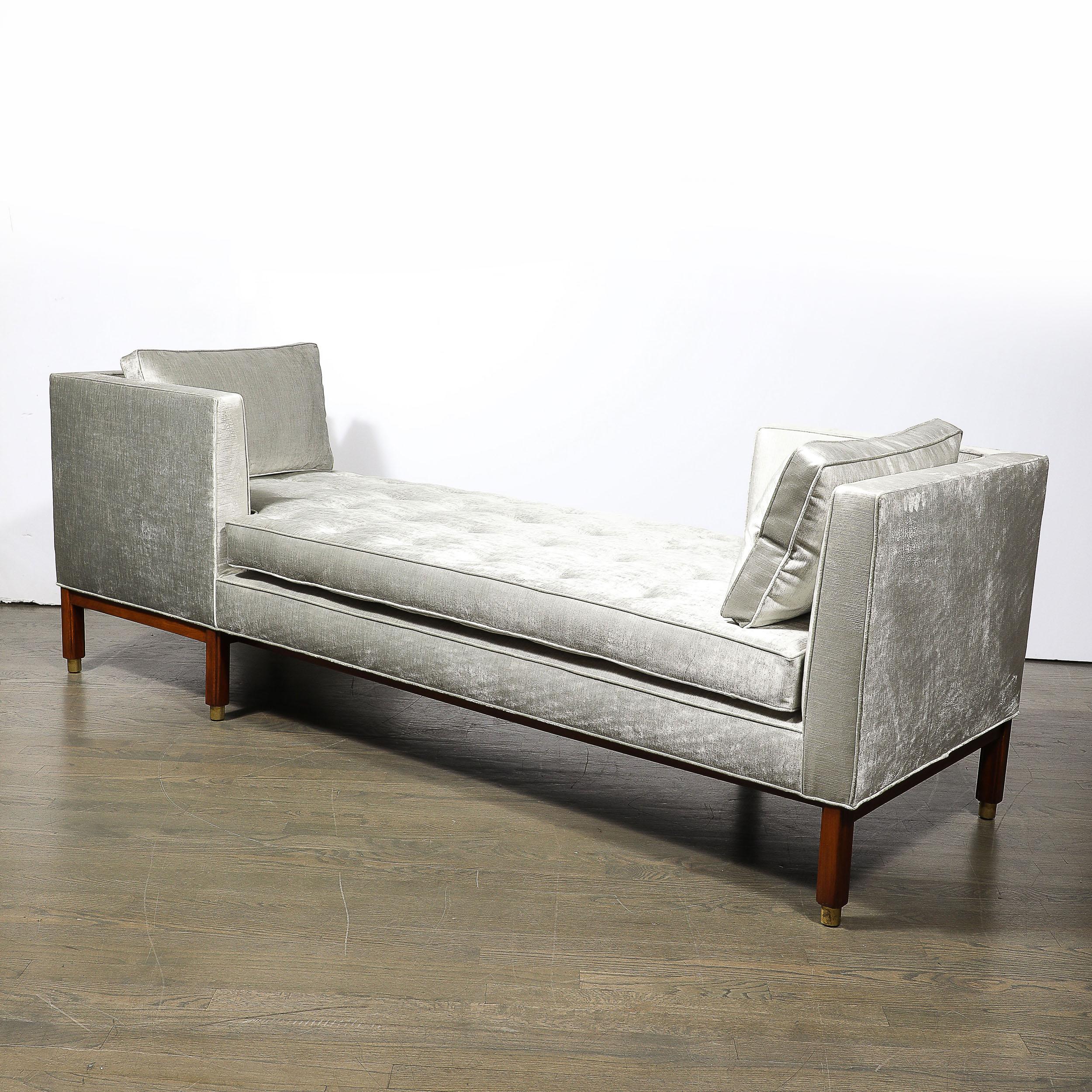 This dynamic and well designed Mid-Century Modernist Tete a Tete Sofa in Walnut & Platinum Velvet W/Brass Sabots is by Edward Wormley for Dunbar and originates from the United States, Circa 1950. Features a well proportioned geometric composition