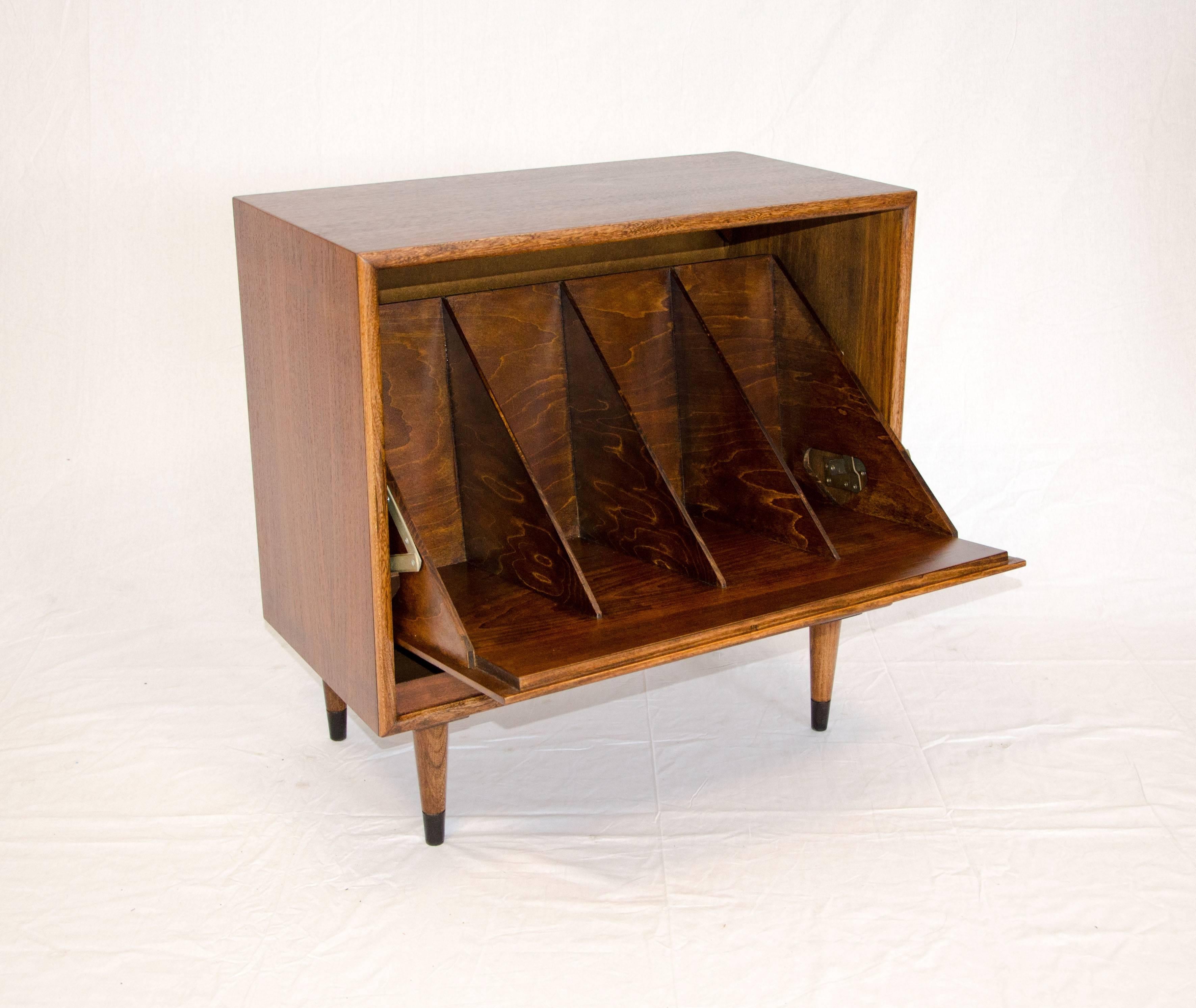 Unusual record storage cabinet with the signature Lane of Altavista, VA walnut drawer fronts accented with oak dovetail patterns on both sides. The top drawer handle pulls down to reveal a divided record (LP or folder) storage space. The entire pull
