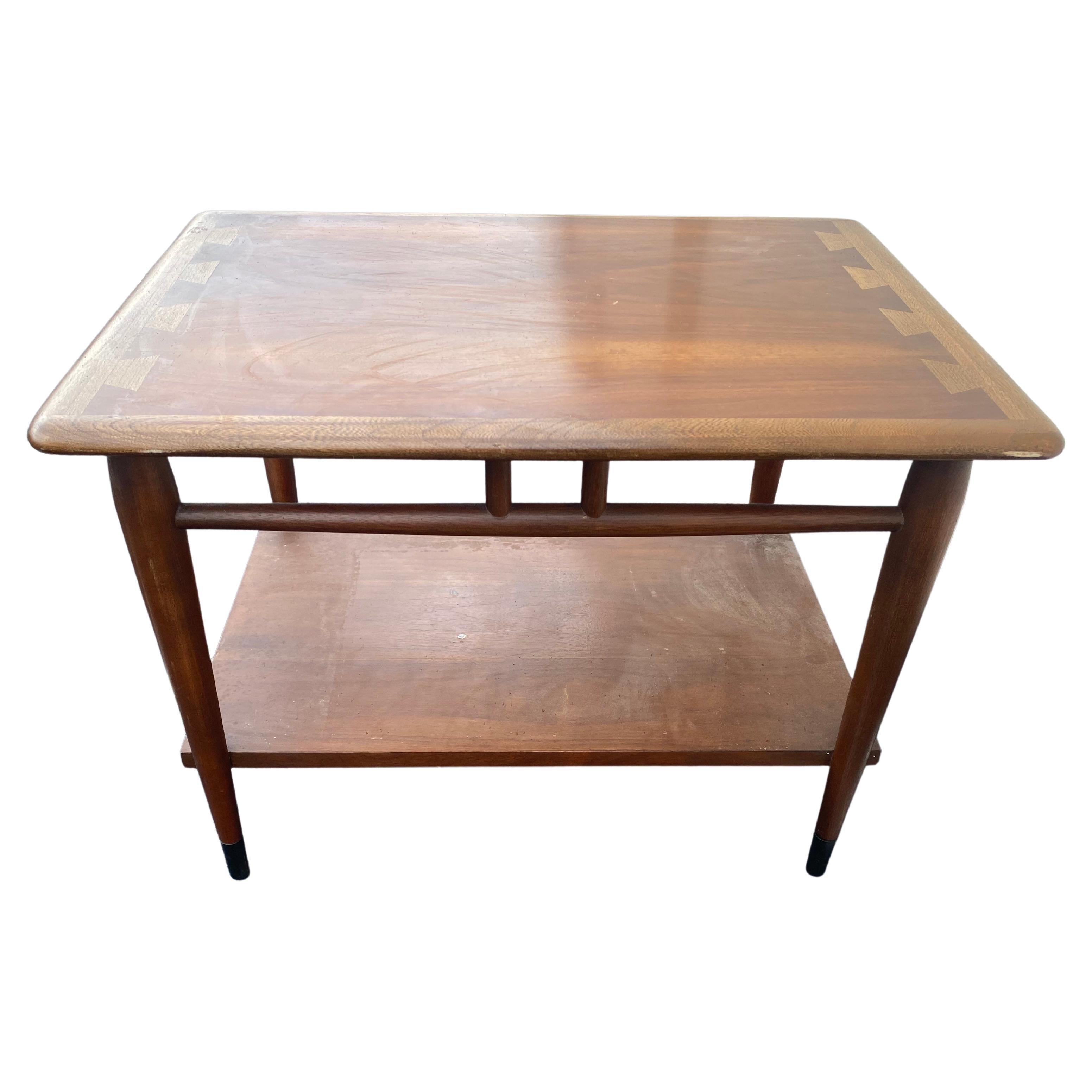 Mid-century walnut side table by Lane, Acclaim. Walnut side table by Lane Furniture, part of the Acclaim line designed by Andre Bus showcasing his iconic two-tone wood dovetail, using walnut and fruit woods. Beautiful wood tone and black metal