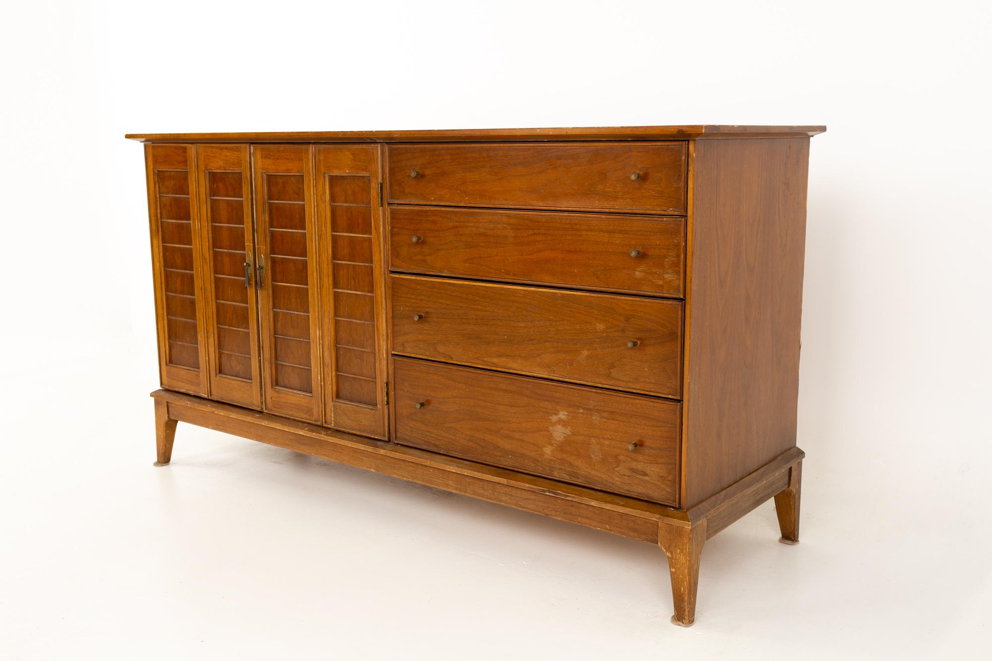 Mid century walnut sideboard buffet credenza
This buffet is 58 wide x 19 deep x 31.75 inches high

All pieces of furniture can be had in what we call restored vintage condition. That means the piece is restored upon purchase so it’s free of
