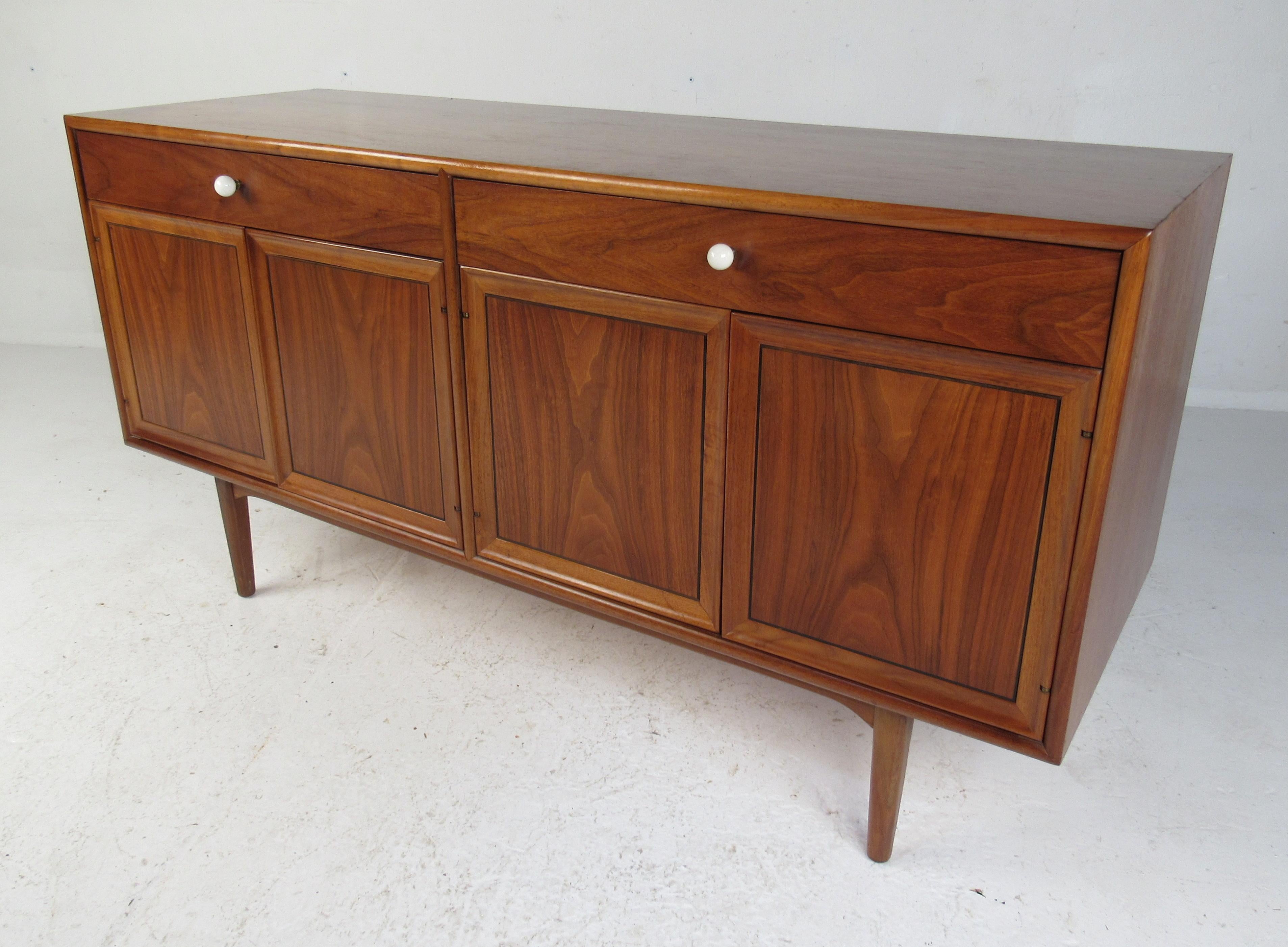Beautiful wood grain with clean lines, this walnut sideboard was designed by Kip Stewart and Stewart MacDougall for the 