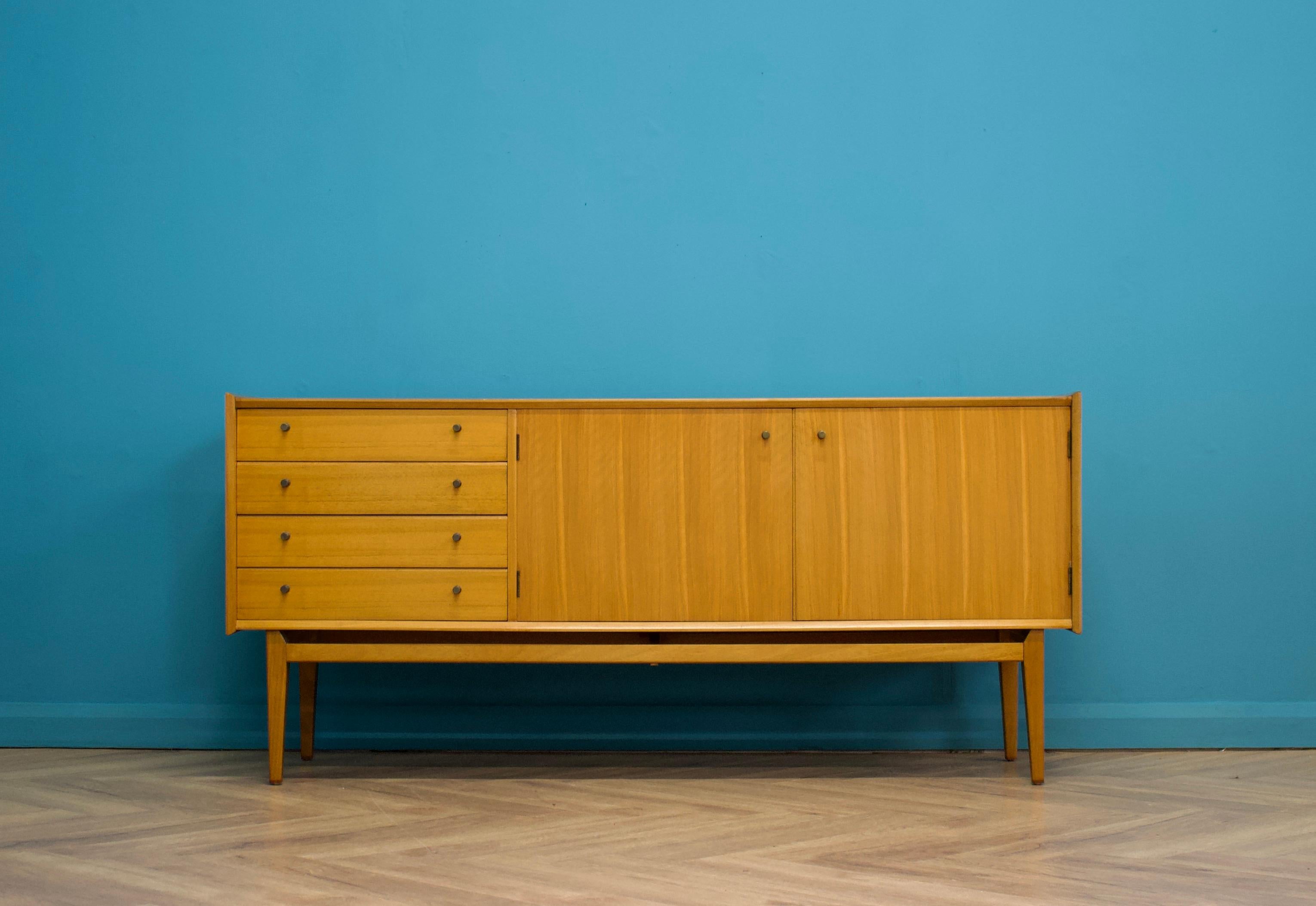 A walnut sideboard from Younger

Featuring a cupboard  and four drawers