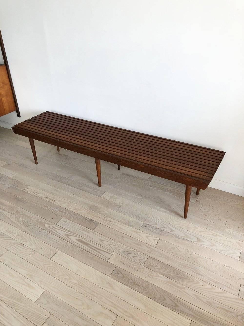 Amazing condition six legged and 6 foot long walnut slat bench. From the 1960s made in Yugoslavia. Great used as a coffee table or a bench for sitting. Excellent condition, sturdy and strong. 

Measure: 16