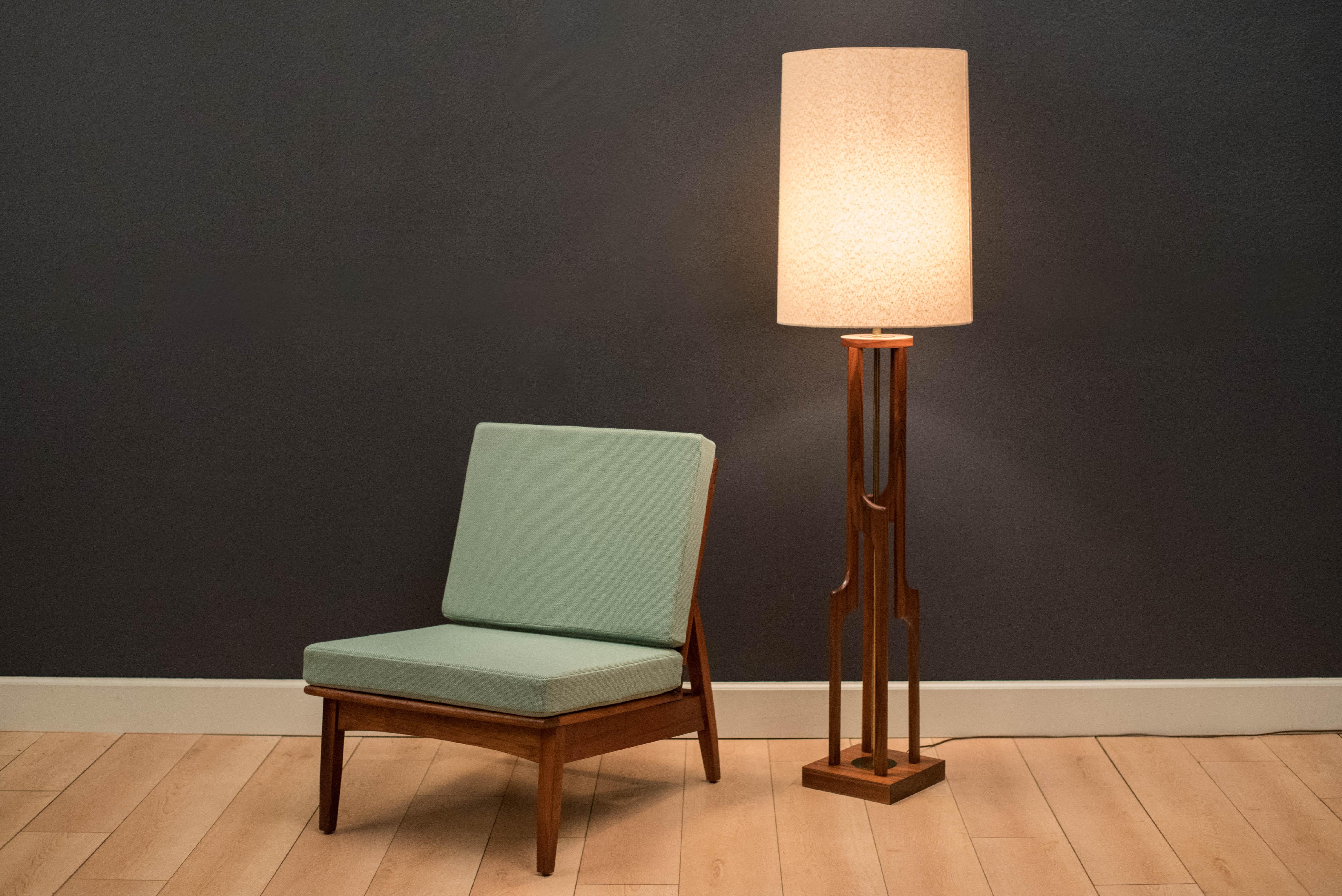 Vintage armless slipper lounge chair in walnut, circa 1960s. This accent piece is newly reupholstered in a seafoam green tweed fabric with brand new cushions.