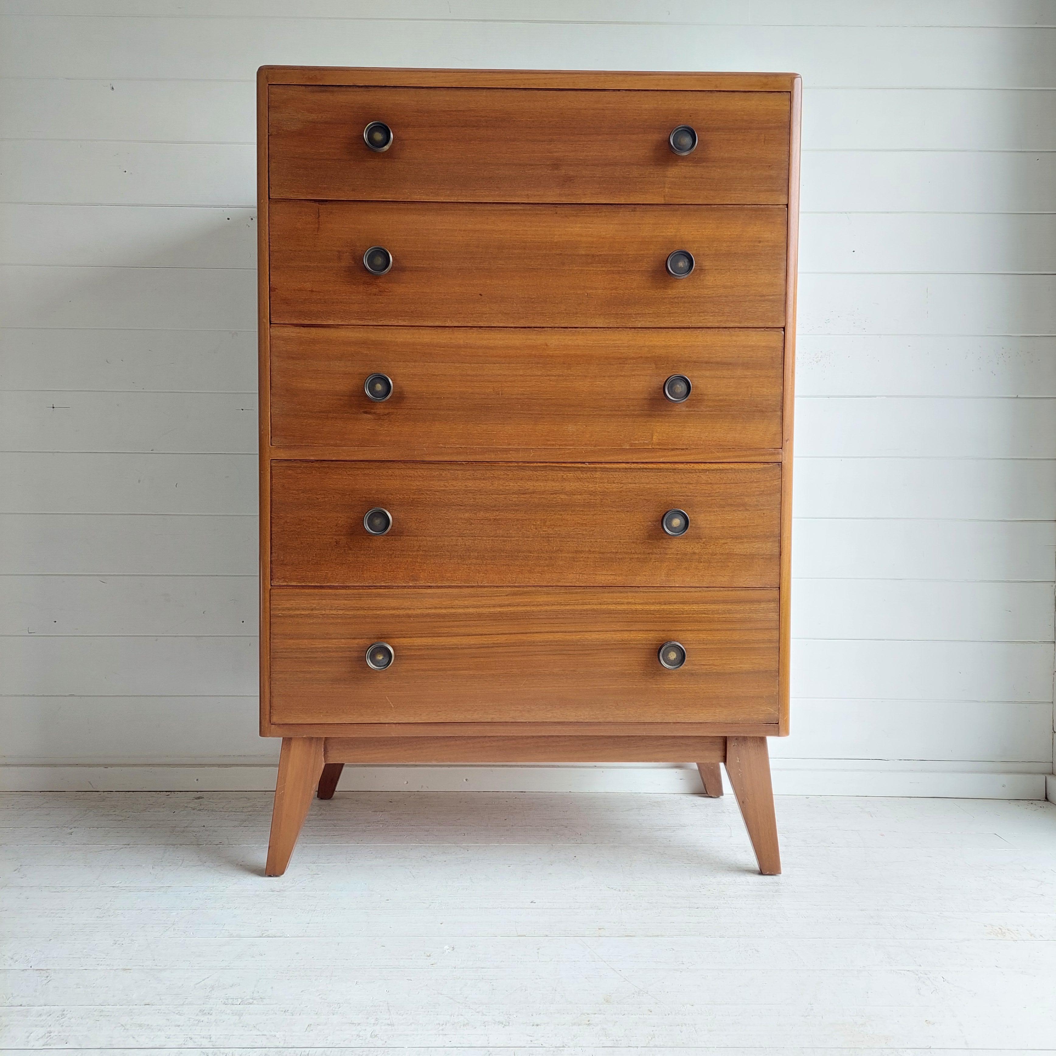A beautifully designed & crafted Walnut 'tallboy' chest of drawers 
Manufactured most probably by  Herbert Gibbs
Dating from the 50s / 60s

It’s really well made with beautiful grain patterns and an interesting design. 
With sleek minimalist design