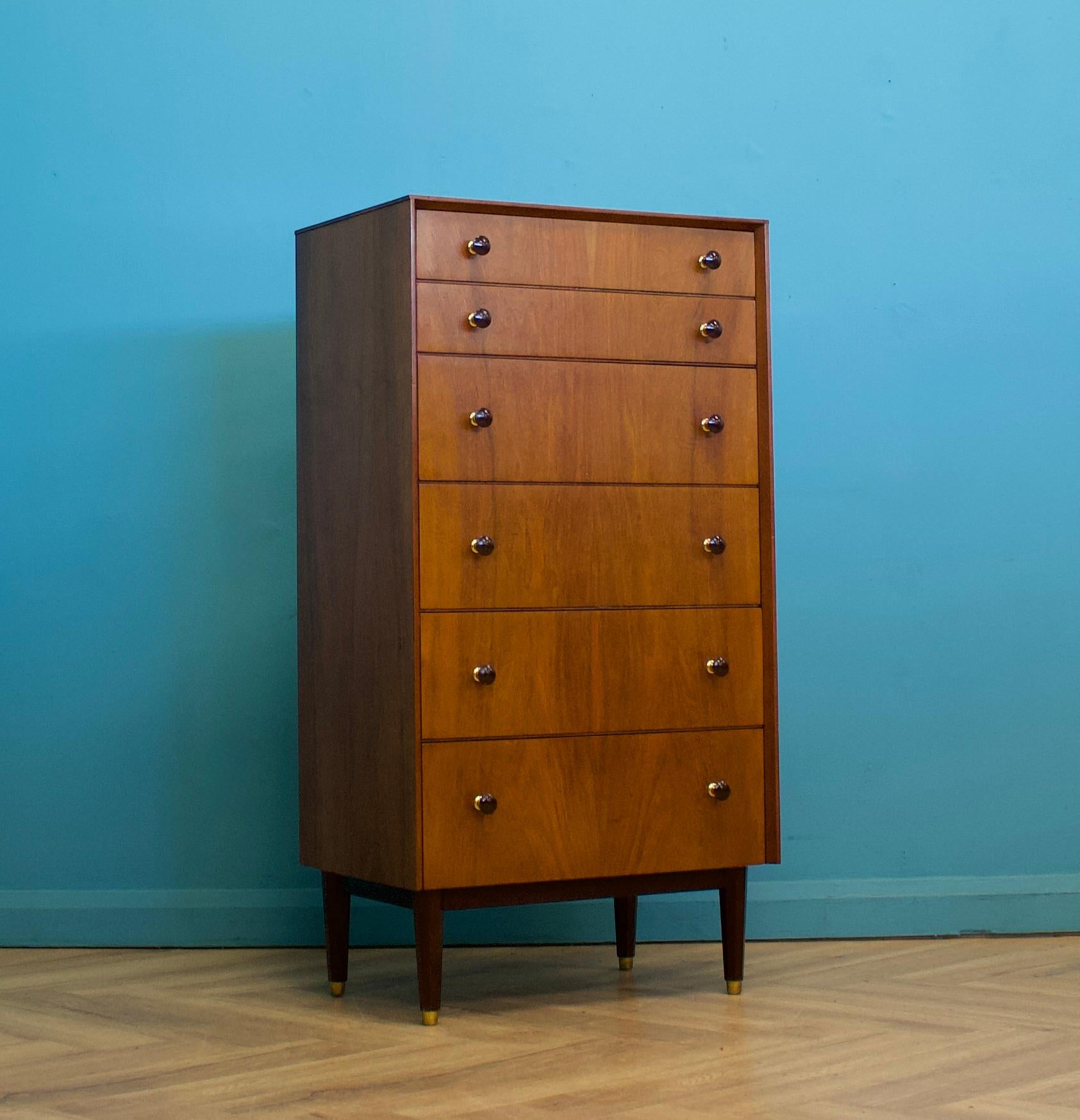 A mid century walnut tallboy chest of drawers from the quality furniture makers, G Plan (E Gomme)
Dating from the early 1960s

There are six drawers in total - each having a brass and walnut handle