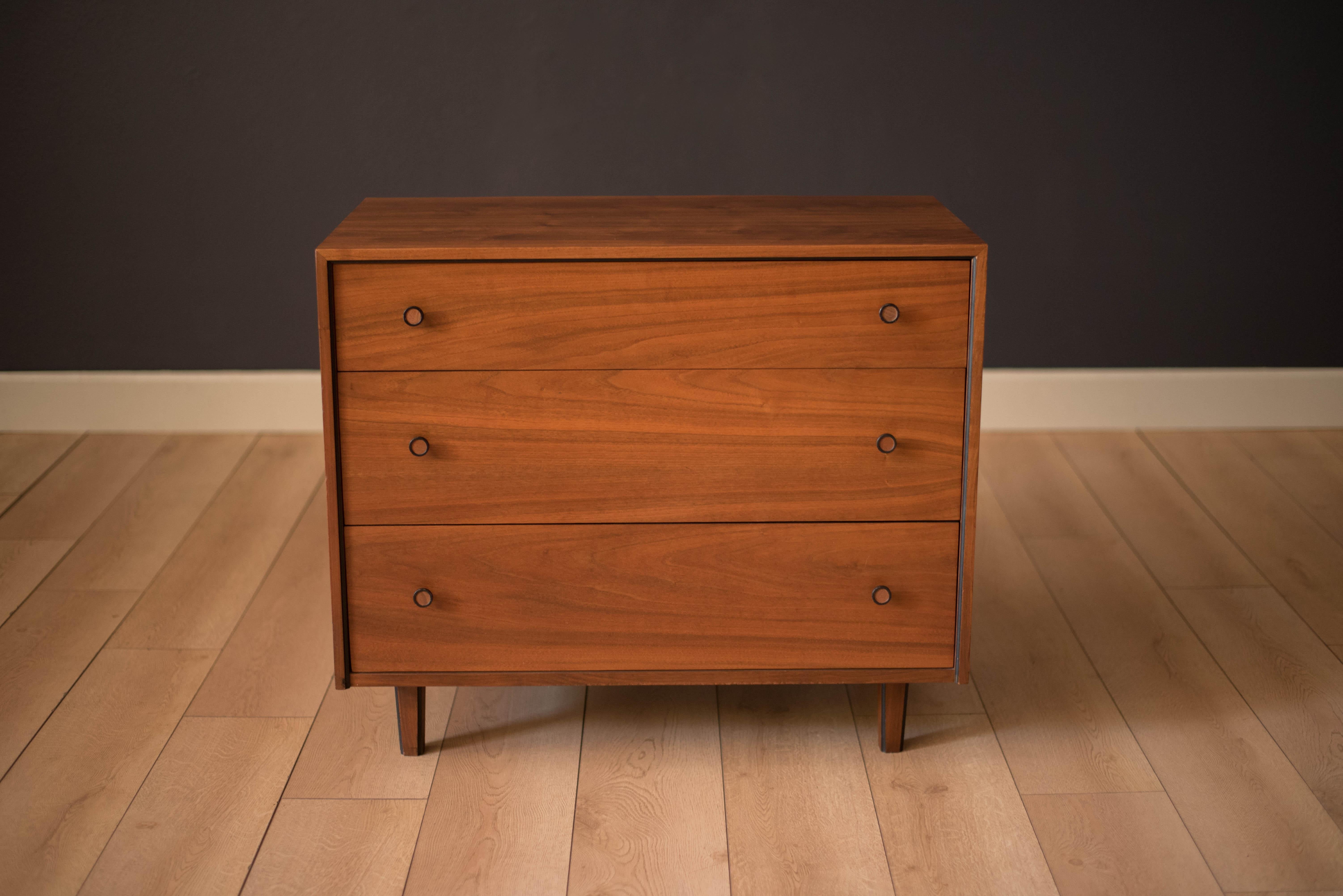 Vintage American 3-drawer dresser chest in walnut. This piece offers plenty of storage with deep interior space and dovetailed drawers. Features black accents with round walnut pulls.


Offered by Mid Century Maddist