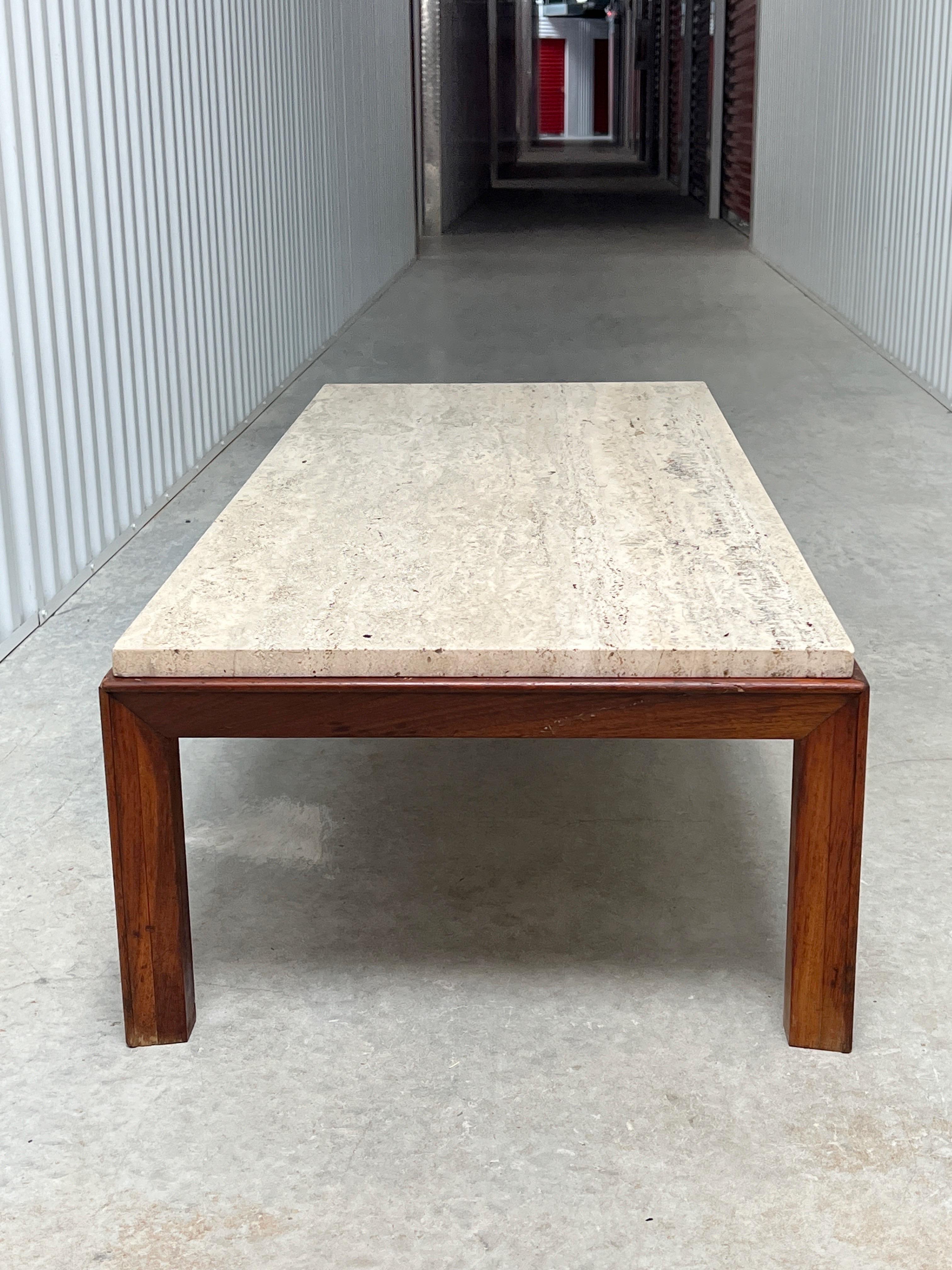 Presenting an exquisite vintage low Walnut Travertine Coffee Table. This table showcases a sleek and stylish design, making it a truly remarkable piece. It is undeniably a great addition to any space, offering both aesthetic appeal and functionality.