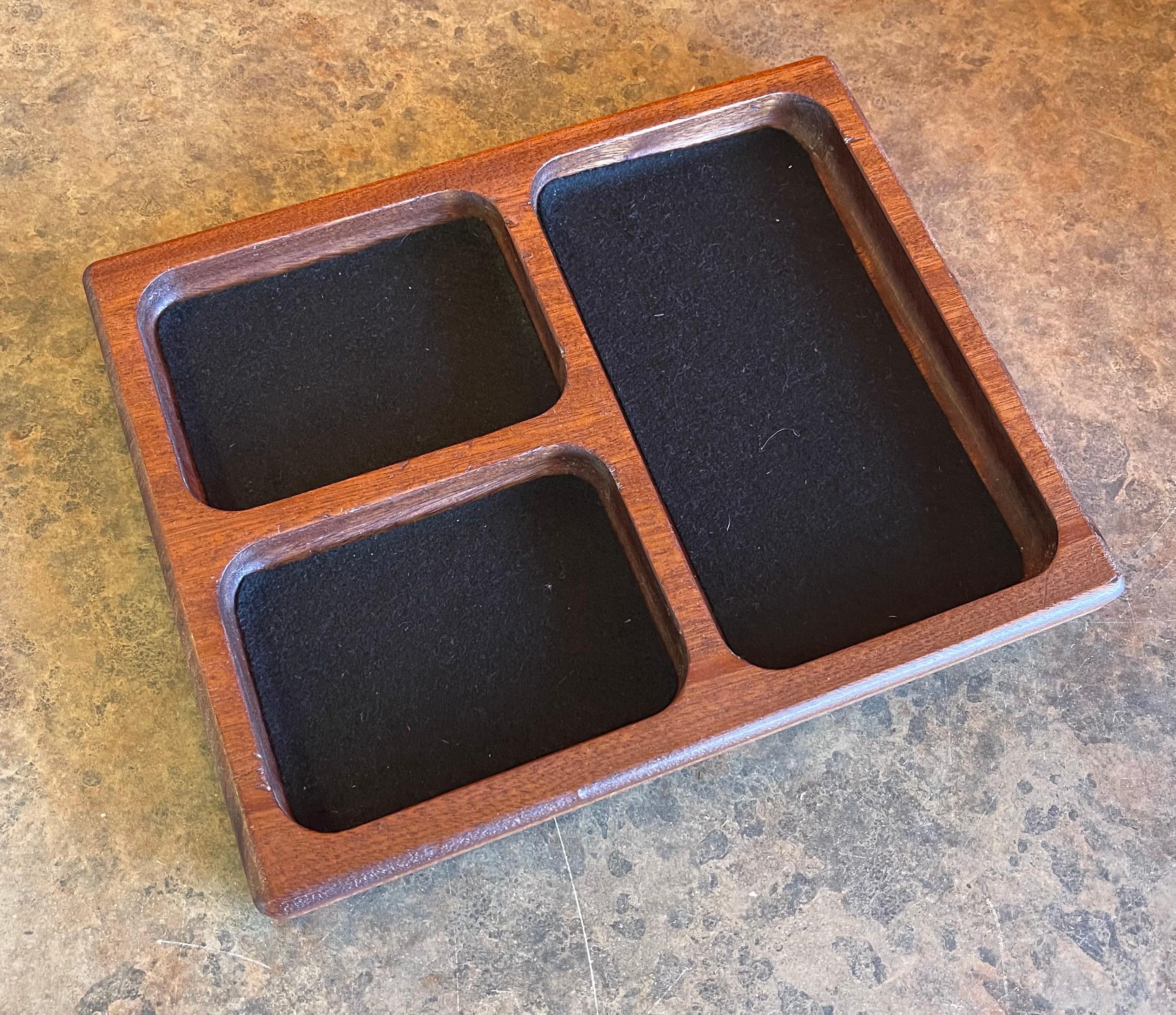 A fun midcentury walnut trinket tray / catch all, circa 1970s. The piece is in very good vintage condition and measures 8