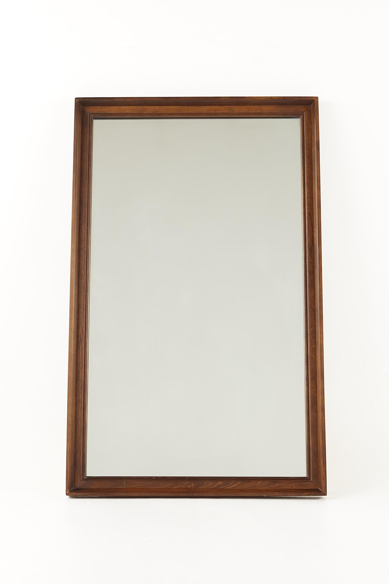 Mid century walnut wall mirror 

This mirror measures: 27 wide x 2 deep x 44 inches high

All pieces of furniture can be had in what we call restored vintage condition. That means the piece is restored upon purchase so it’s free of watermarks,