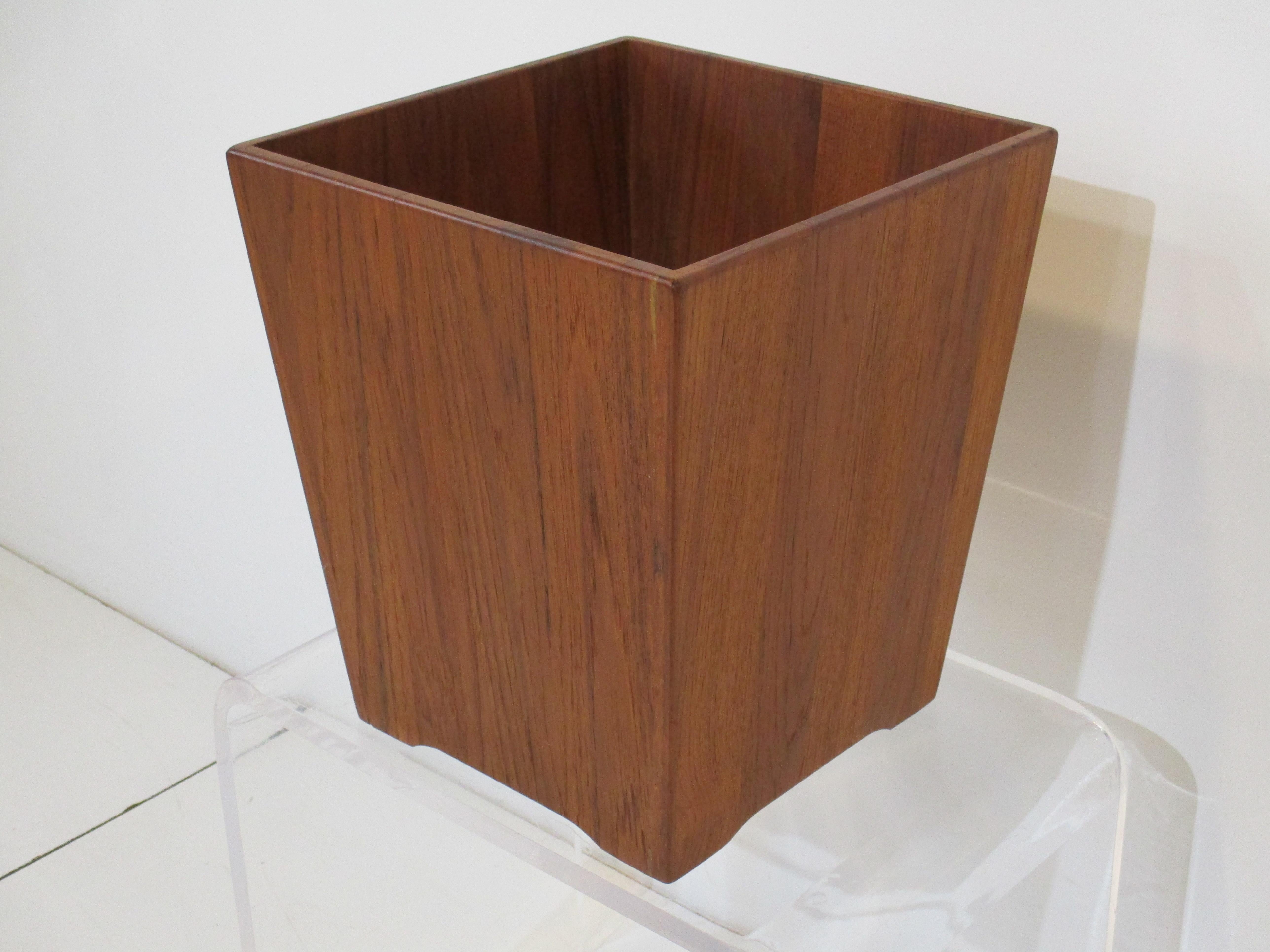 A larger walnut waste basket very well constructed and useful matching most mid century desks from Jens Risom, George Nelson and the Danish styles. Complete the look with this hard to source item.
